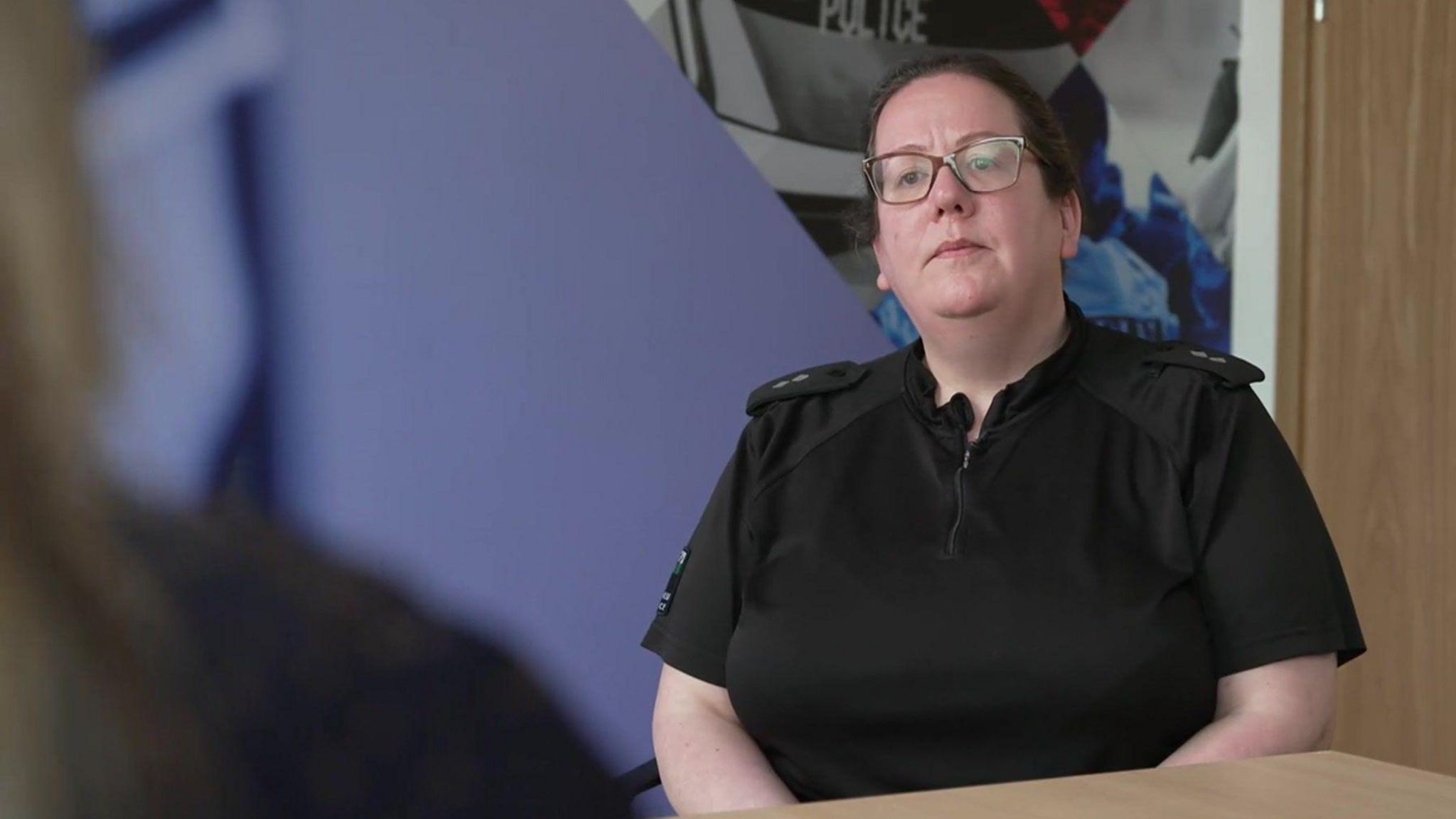 Insp Jodie Davies sitting at a table