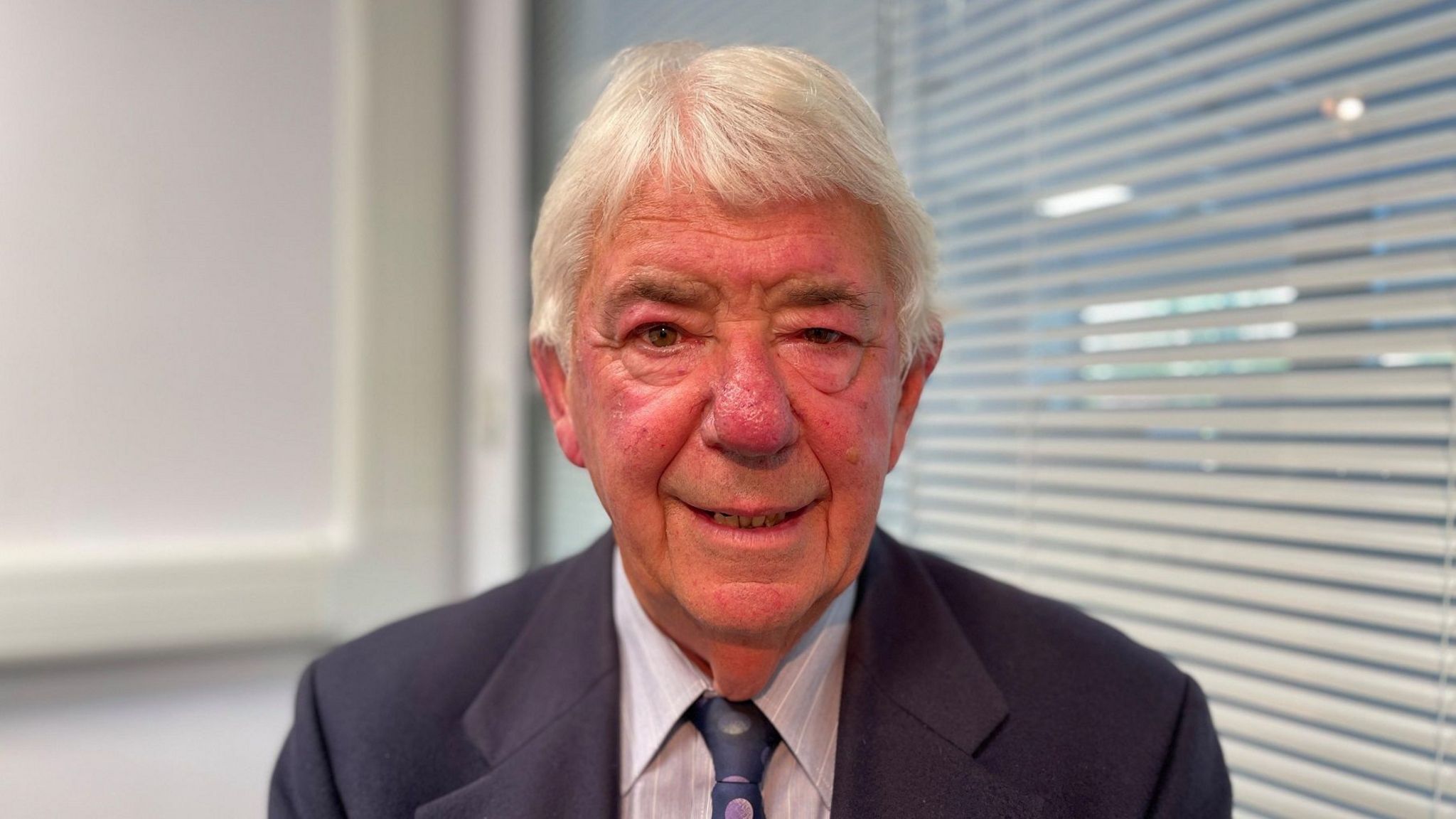 Brian Prickett today, wearing a shirt, a tie and a jacket