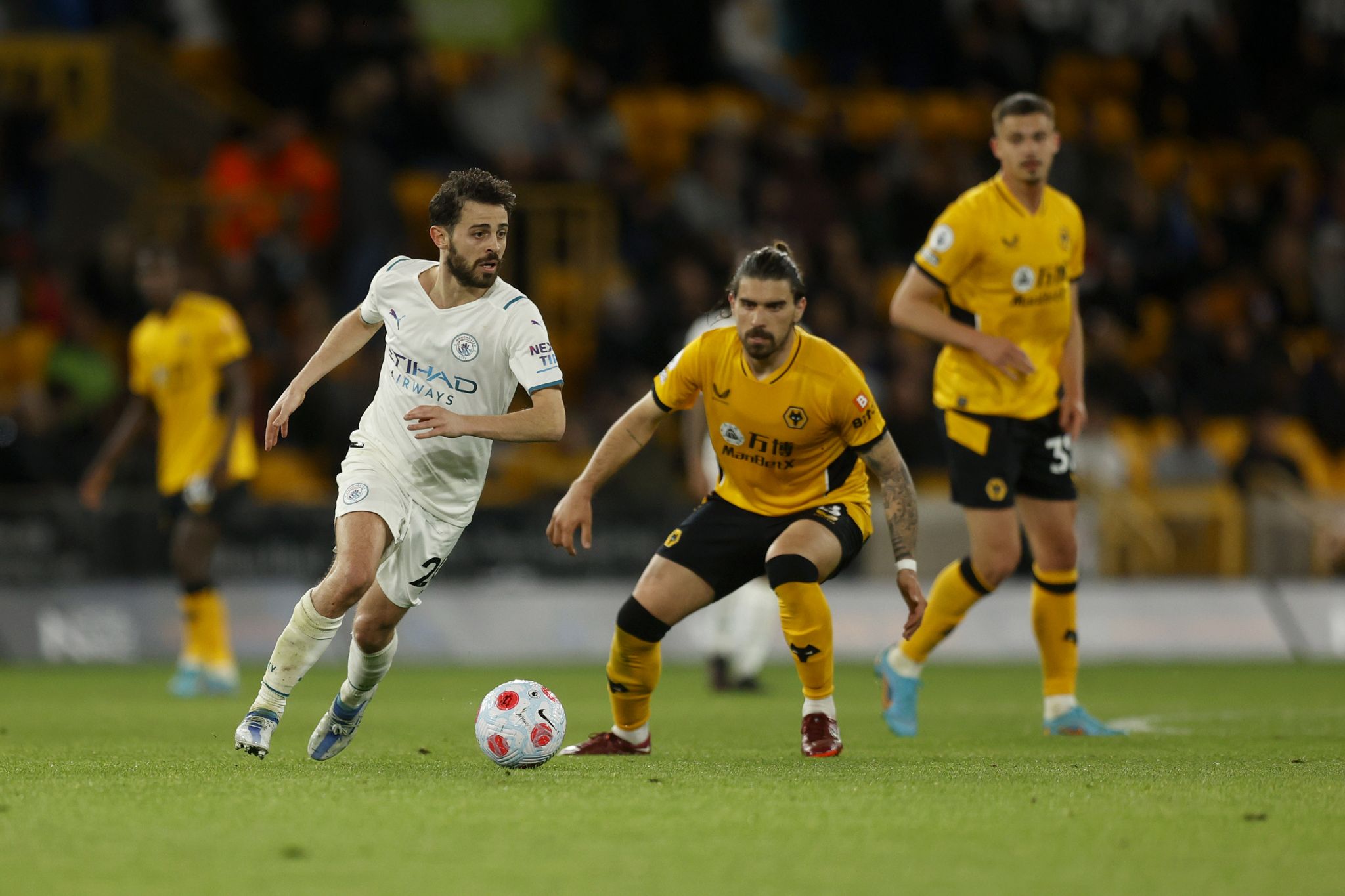 Bernardo Silva turns away from Ruben Neves 