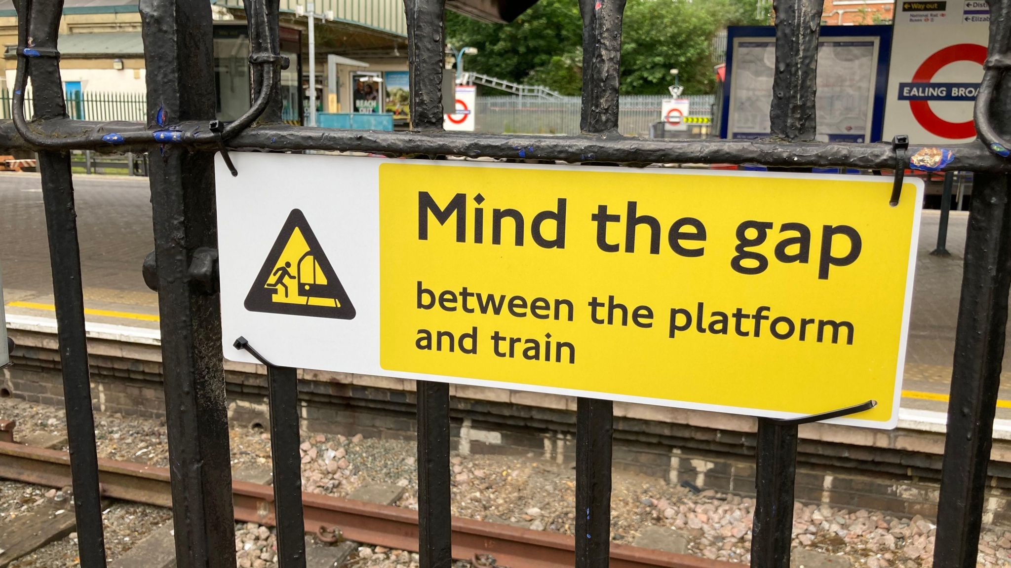 Mind the gap sign at a railway station