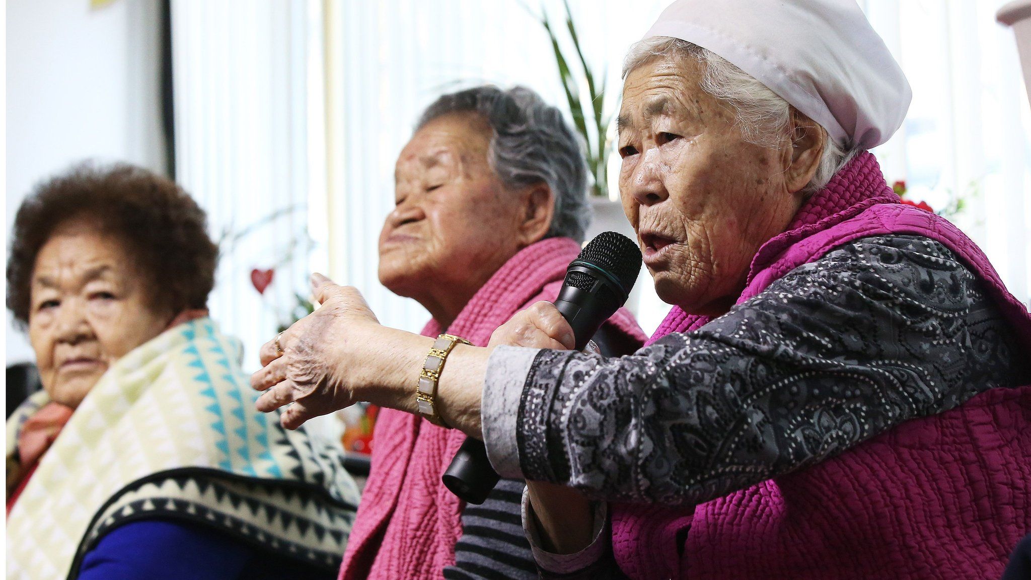 South Korean elderly women who were forced to serve as sex slaves, speak after watching a broadcast of a joint press briefing of South Korea and Japan Foreign Ministers