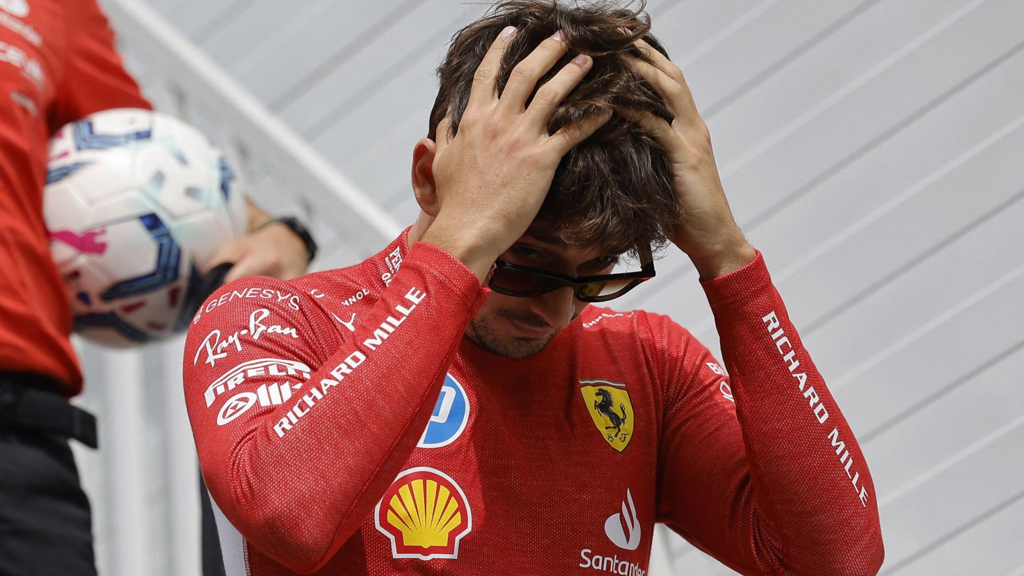 Charles Leclerc ruffles his hair