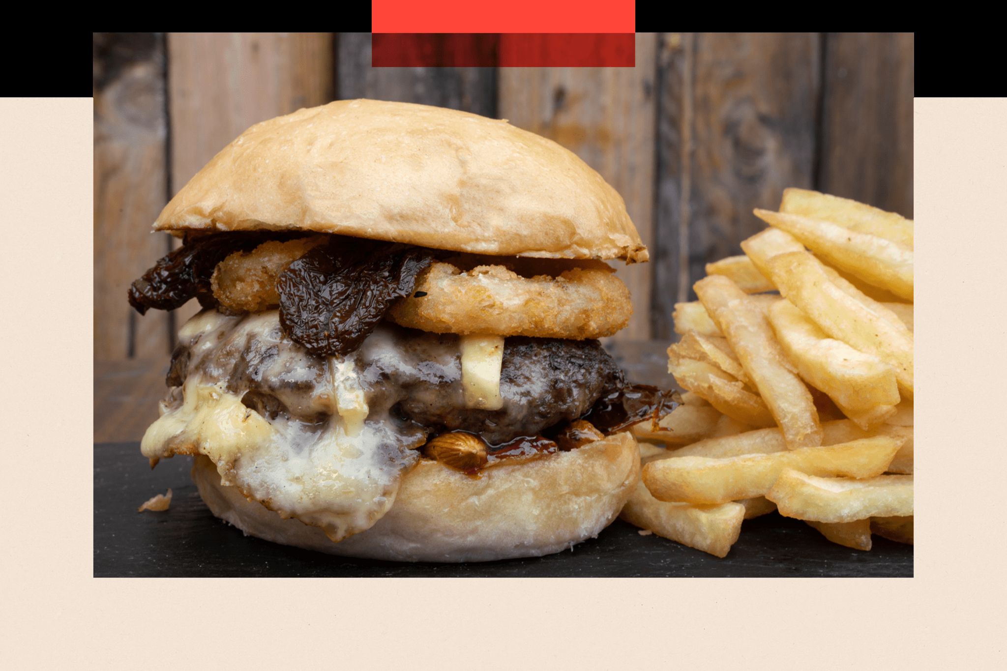 A photo of a burger and chips