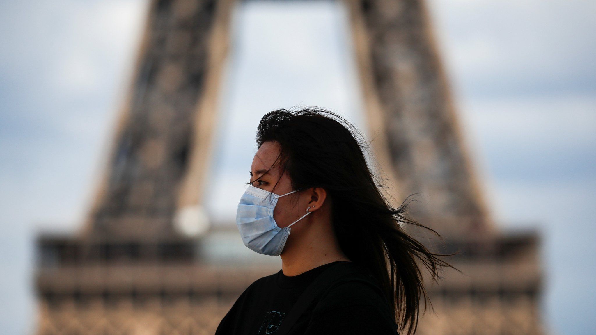 Woman wearing mask in Paris