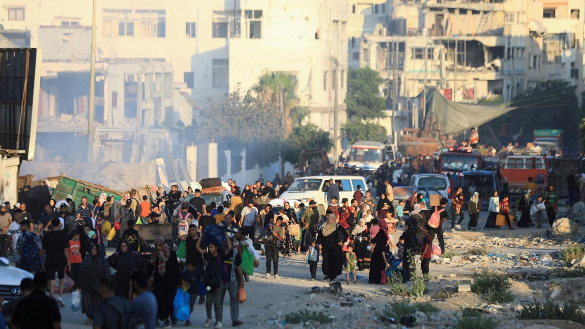 Palestinians flee to an eastern part of Gaza City after they were ordered by Israeli military to evacuate, in the northern Gaza Strip (7 July 2024