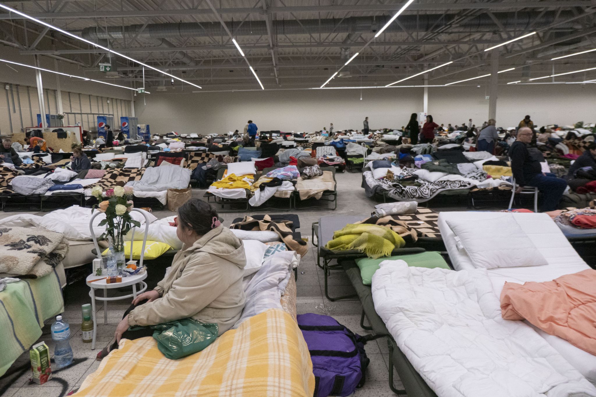 Temporary sleeping area with camp beds and mattresses for people at the Temporary Humanitarian Aid Centre in Przemysl Poland