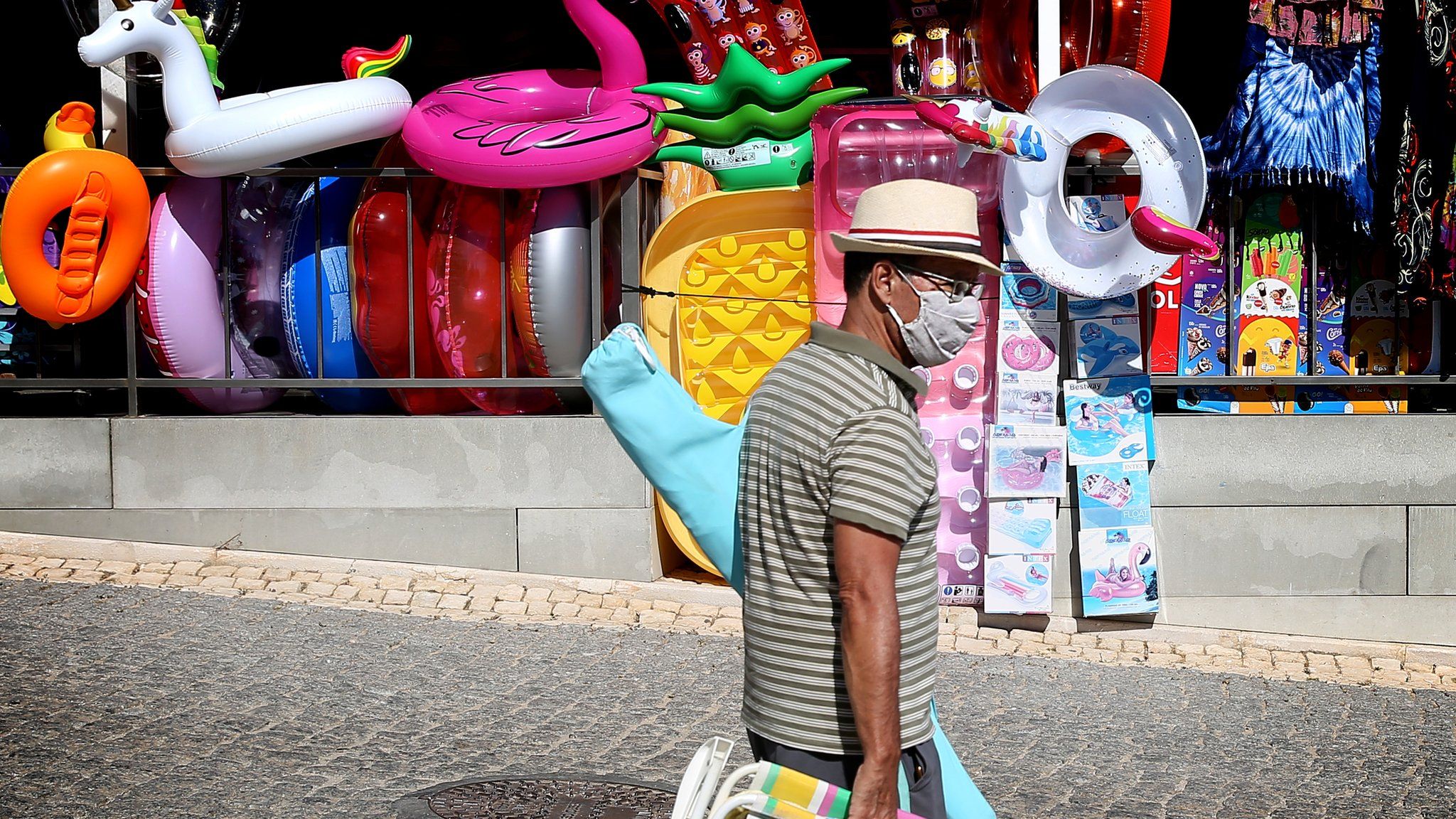 A tourist wears a face mask in Portimao, Algarve, Portugal