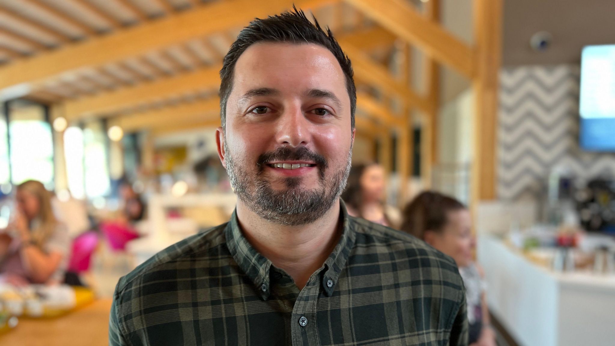 Jason Dunsford smiling at Gloucester Services