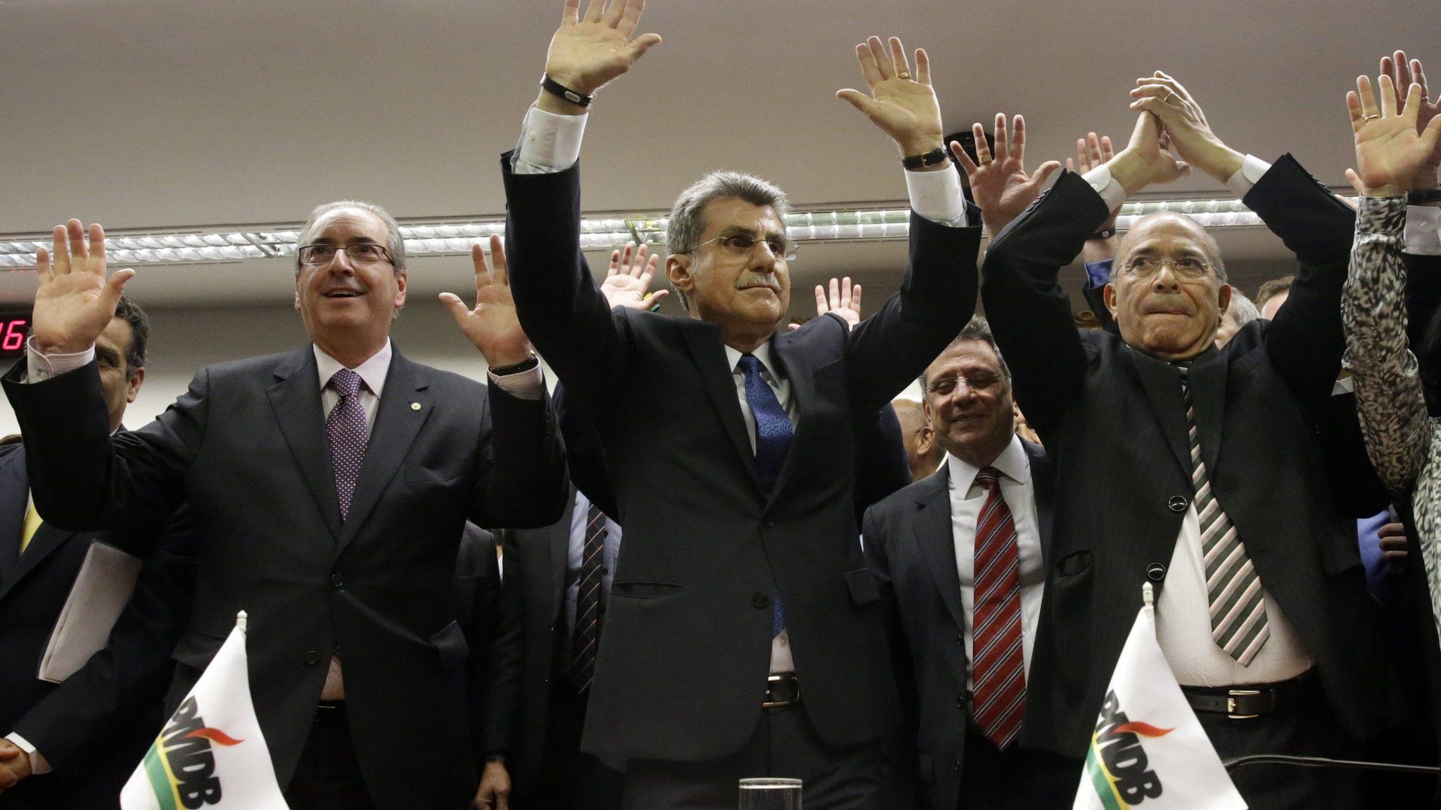 PMDB leaders celebrate after announcing they are withdrawing support for President Rousseff's ruling coalition during National Executive Meeting in Brasilia. March 29, 2016