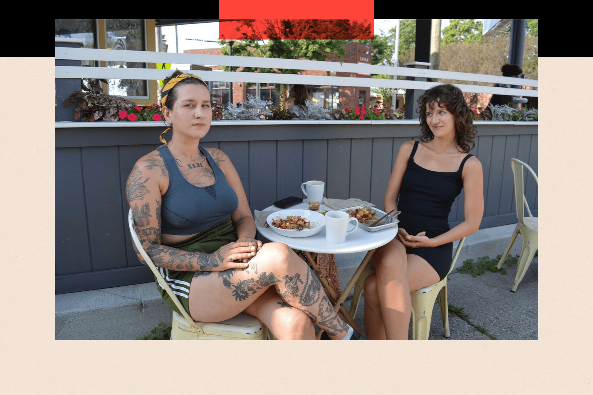 Two women sitting outside a cafe