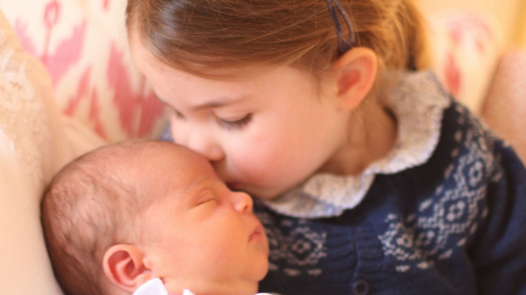 Princess Charlotte is seen with her new brother in the photograph taken on 2 May, 2018 - her third birthday