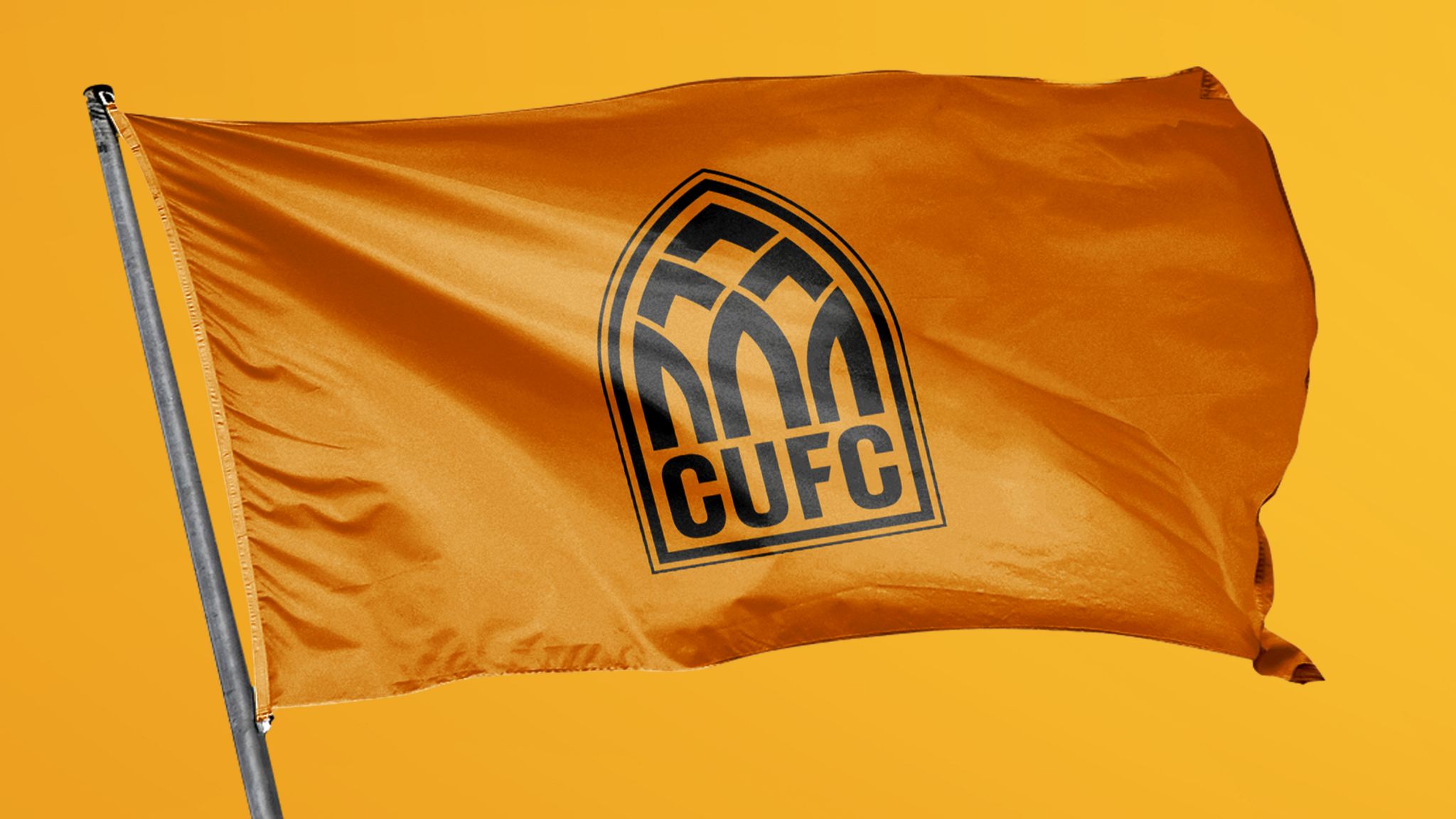 CUFC printed in black on an orange flag with an arched shape around it