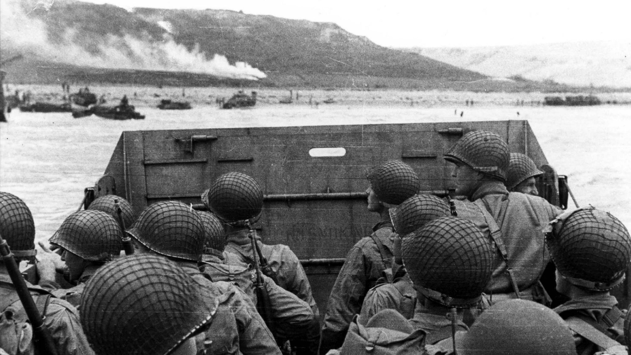U.S. Army troops (soldiers) in an LCVP landing craft approach Normandy"s Omaha Beach on D-Day in Colleville Sur-Mer, France June 6 1944