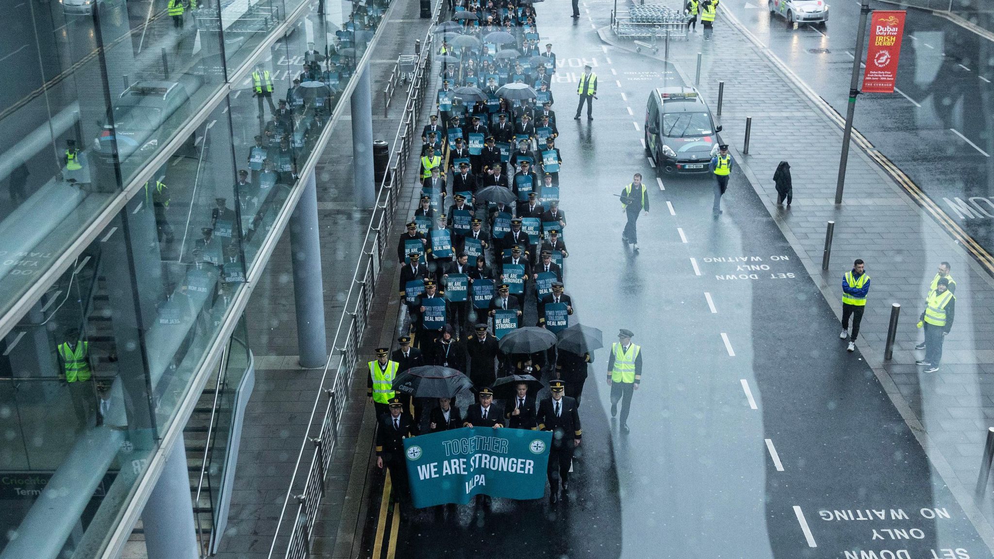 Striking Aer Lingus pilots march around Dublin Airport