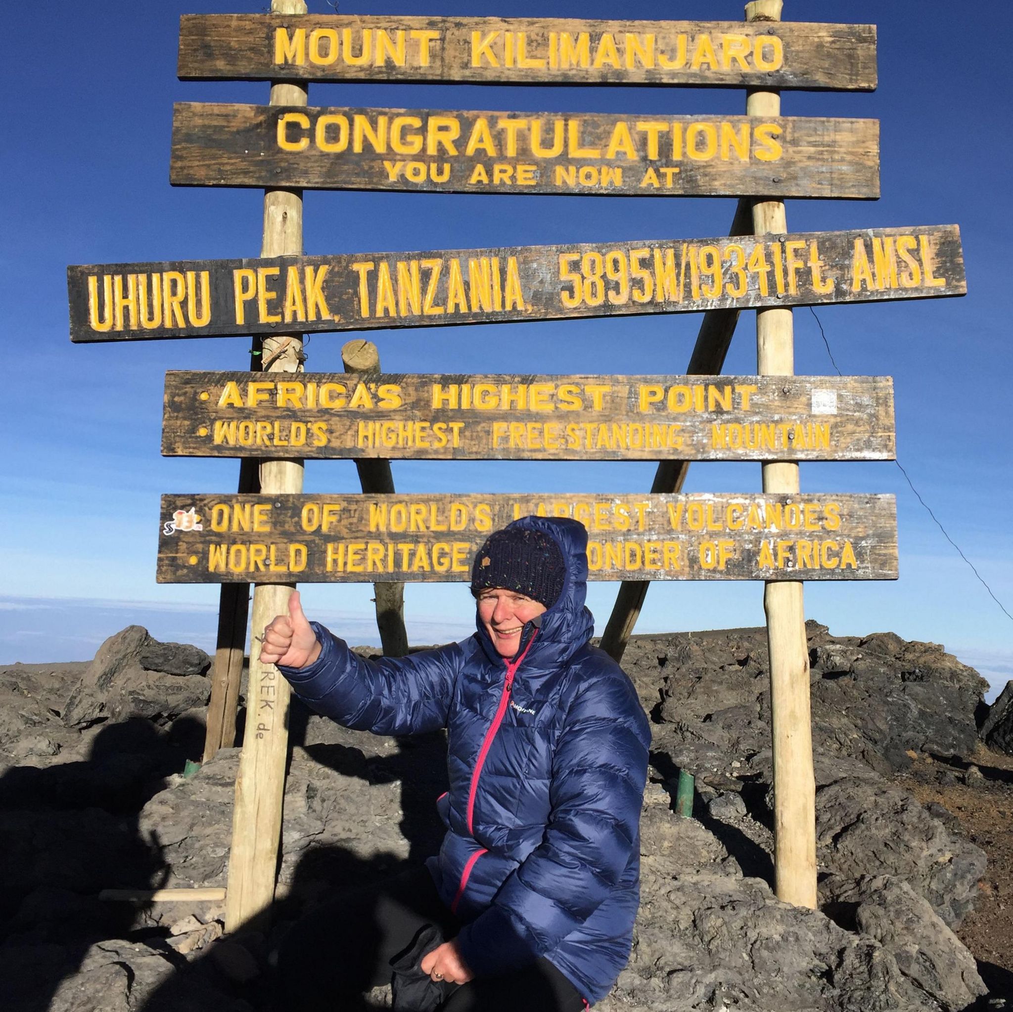 Jane Sutton at the top of Mount Kilimanjaro