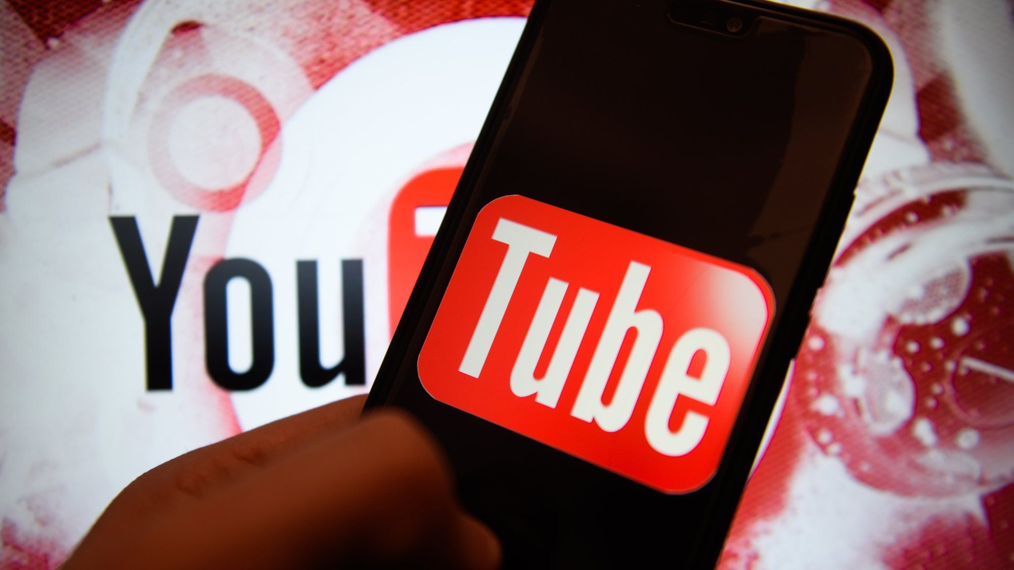 Youtube logo is seen on an android mobile phone.