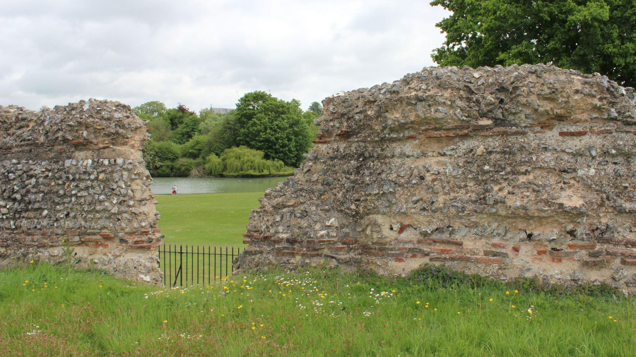 Grass and a old stone wall, said to be Roman ruins, at Verulamium Park 