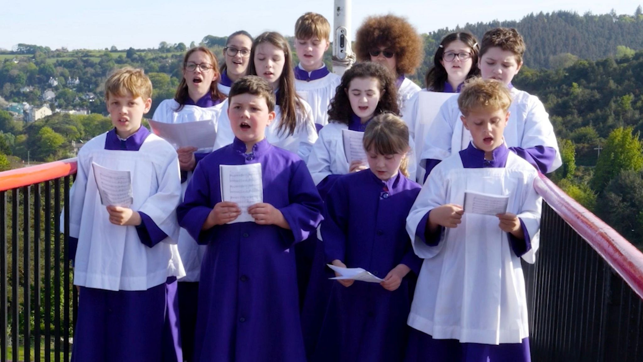 The choristers singing atop the Laxey Wheel 