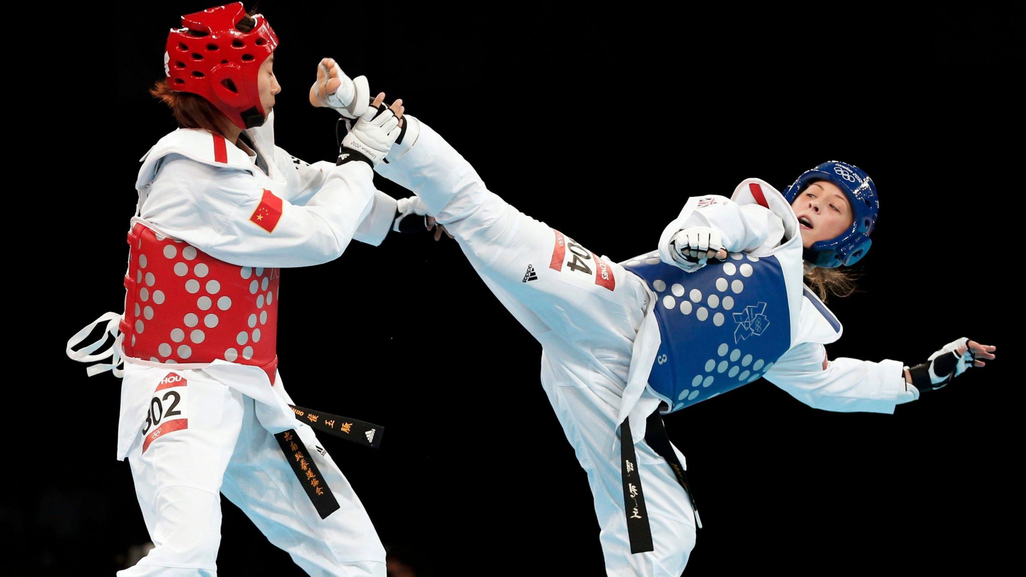 Jade Jones competing against China's Hou Yuzhuo during their -57kg gold medal taekwondo match at the London 2012 Olympics