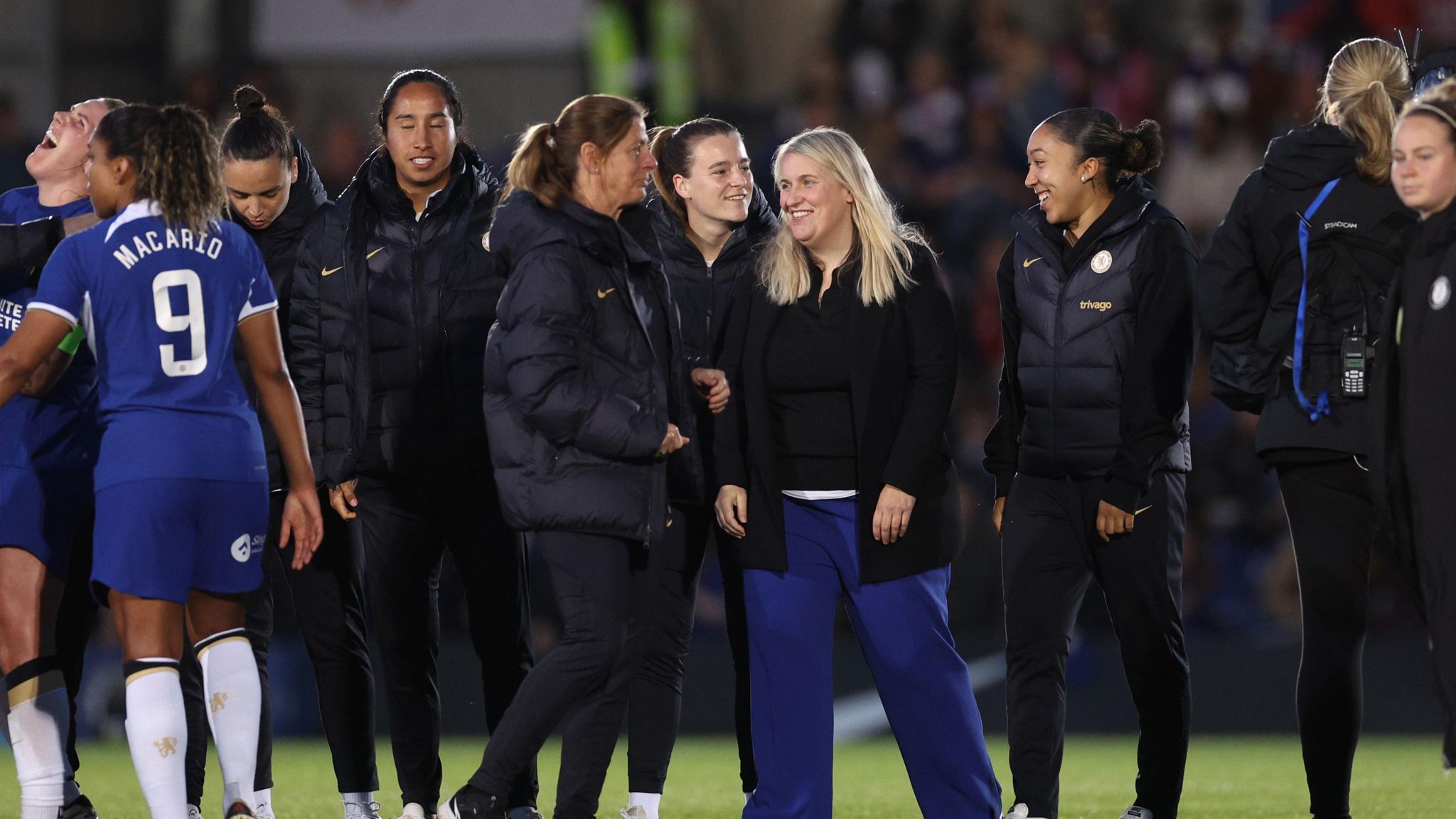 Emma Hayes laughs with her staff and players