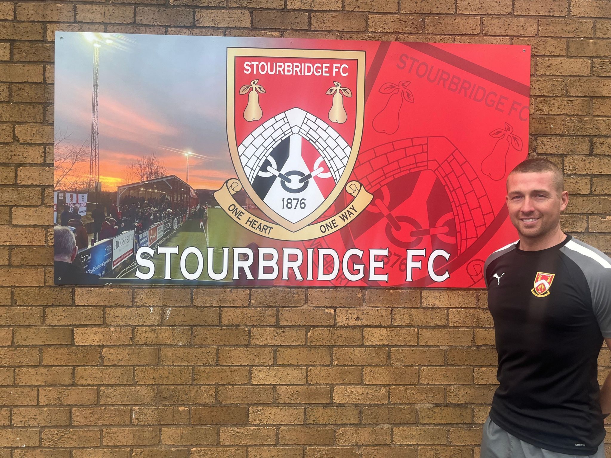 Darryl Knights in front of Stourbridge FC sign