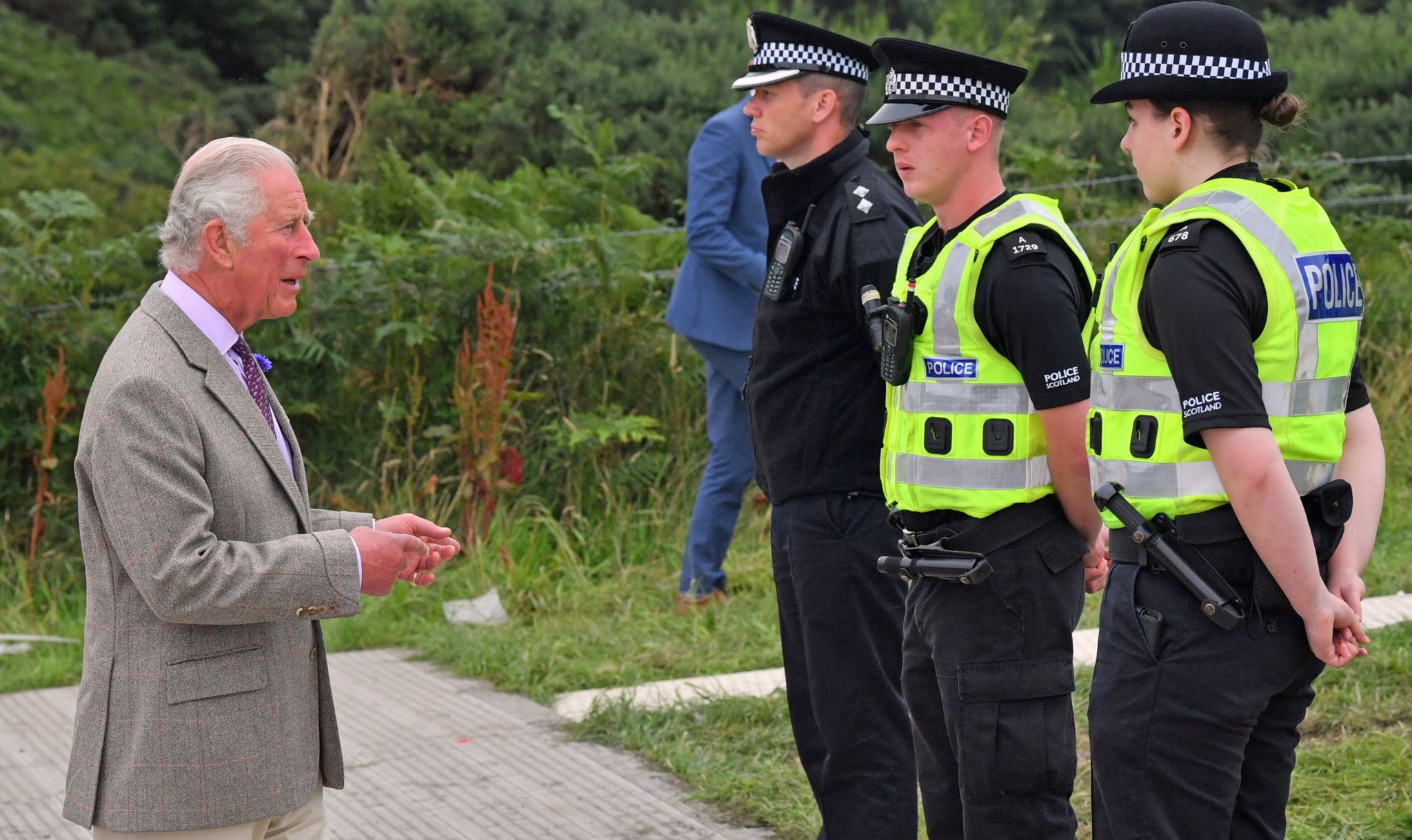 Prince Charles and PC Liam Mercer (middle police officer)