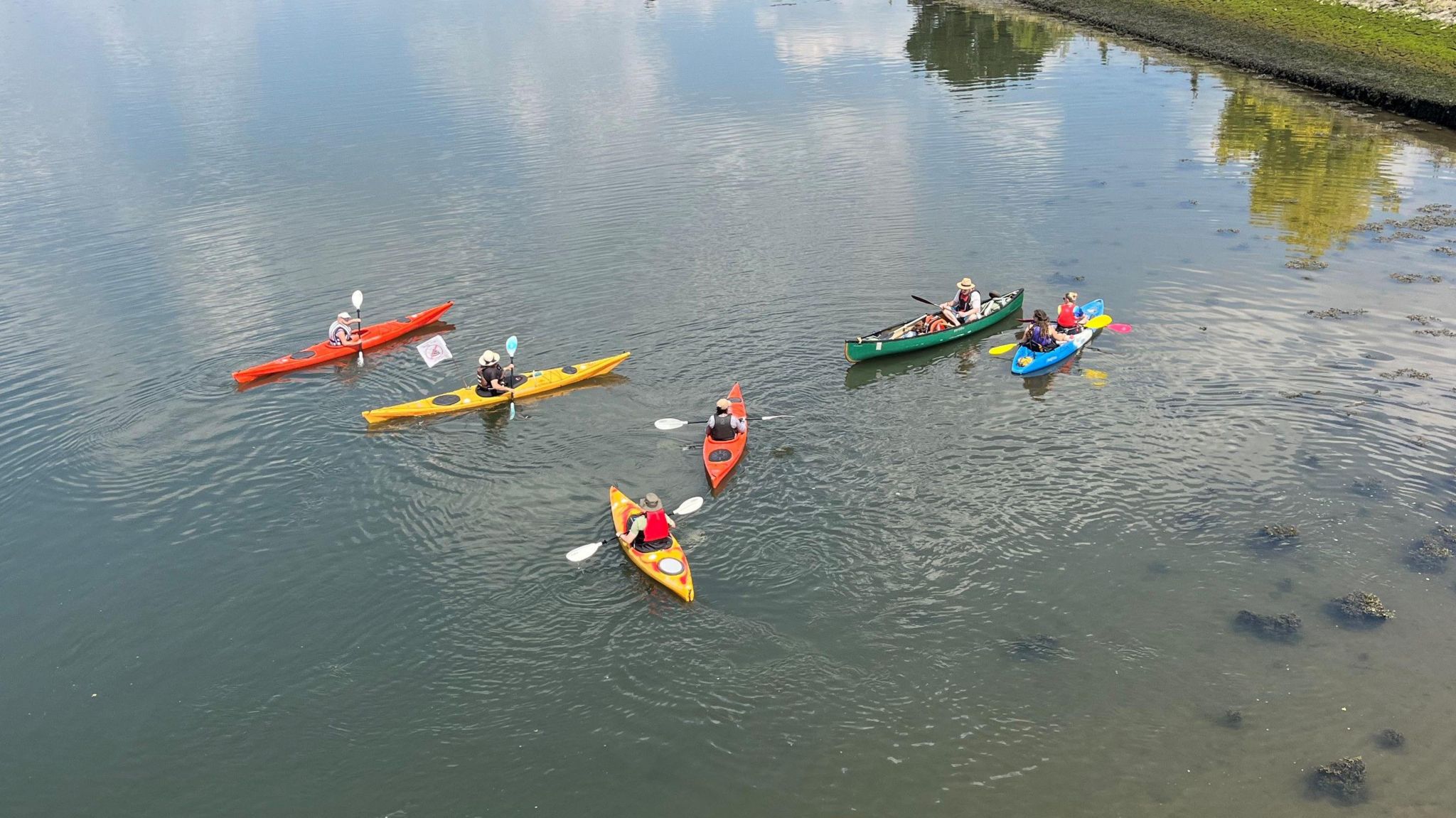 People in kayaks paddling on the river itchen