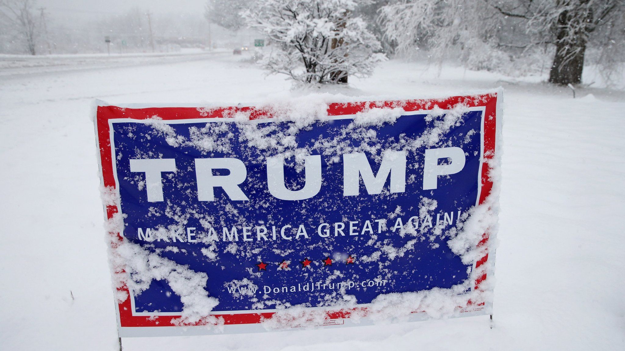 A 2016 Trump campaign sign covered in snow