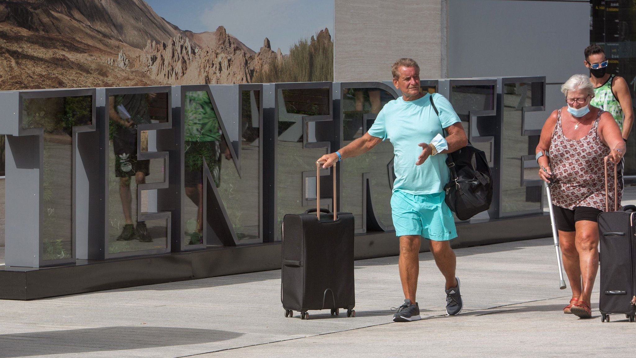 British tourists arrive at the Tenerife Sur Reina Sofia airport on the Canary Island of Tenerife on Tuesday