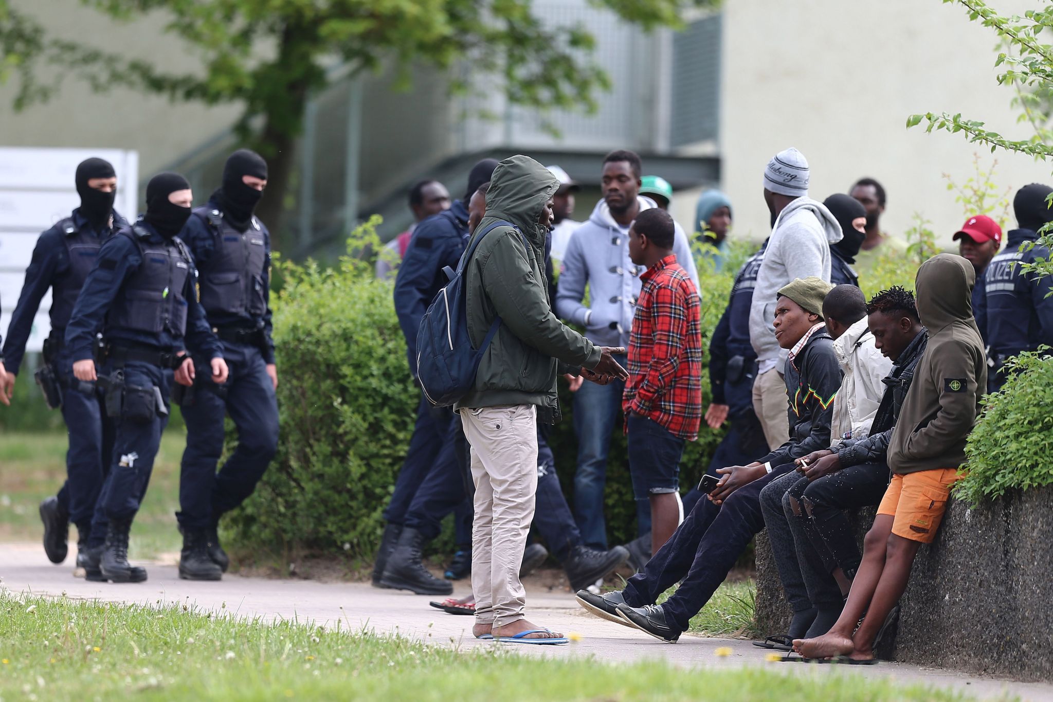 Picture of police intervening at a refugee centre