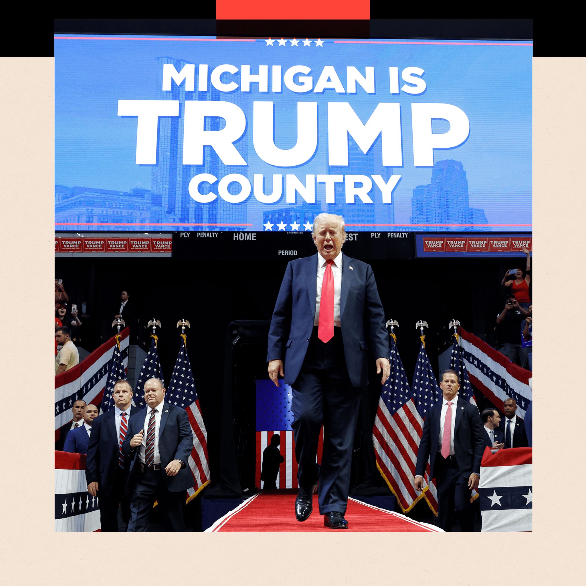 Donald Trump walks in front of a sign that reads 'Michigan is Trump country'