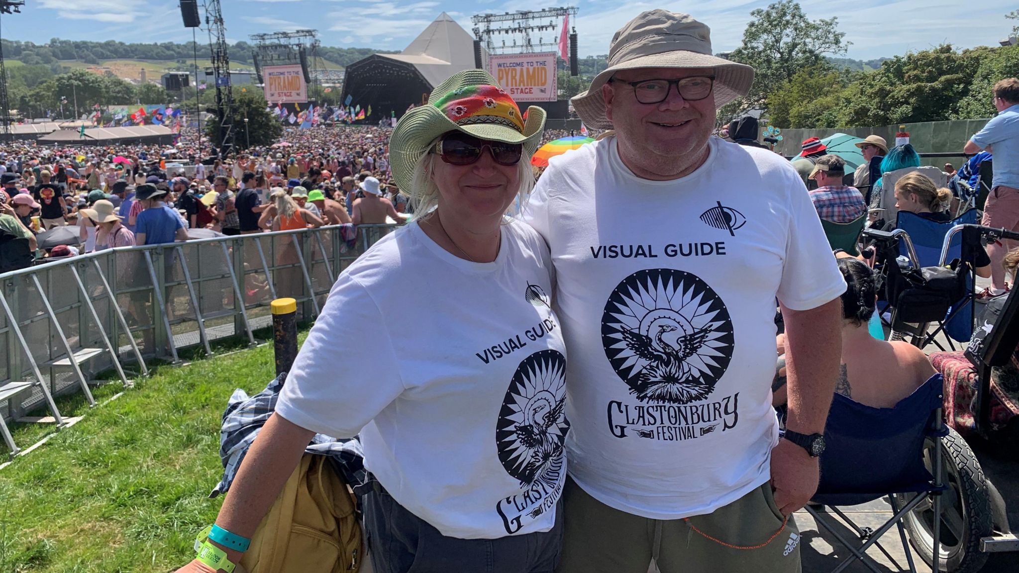 Ms Partington with friend and fellow guide Wyn at the Pyramid Stage at Glastonbury Festival