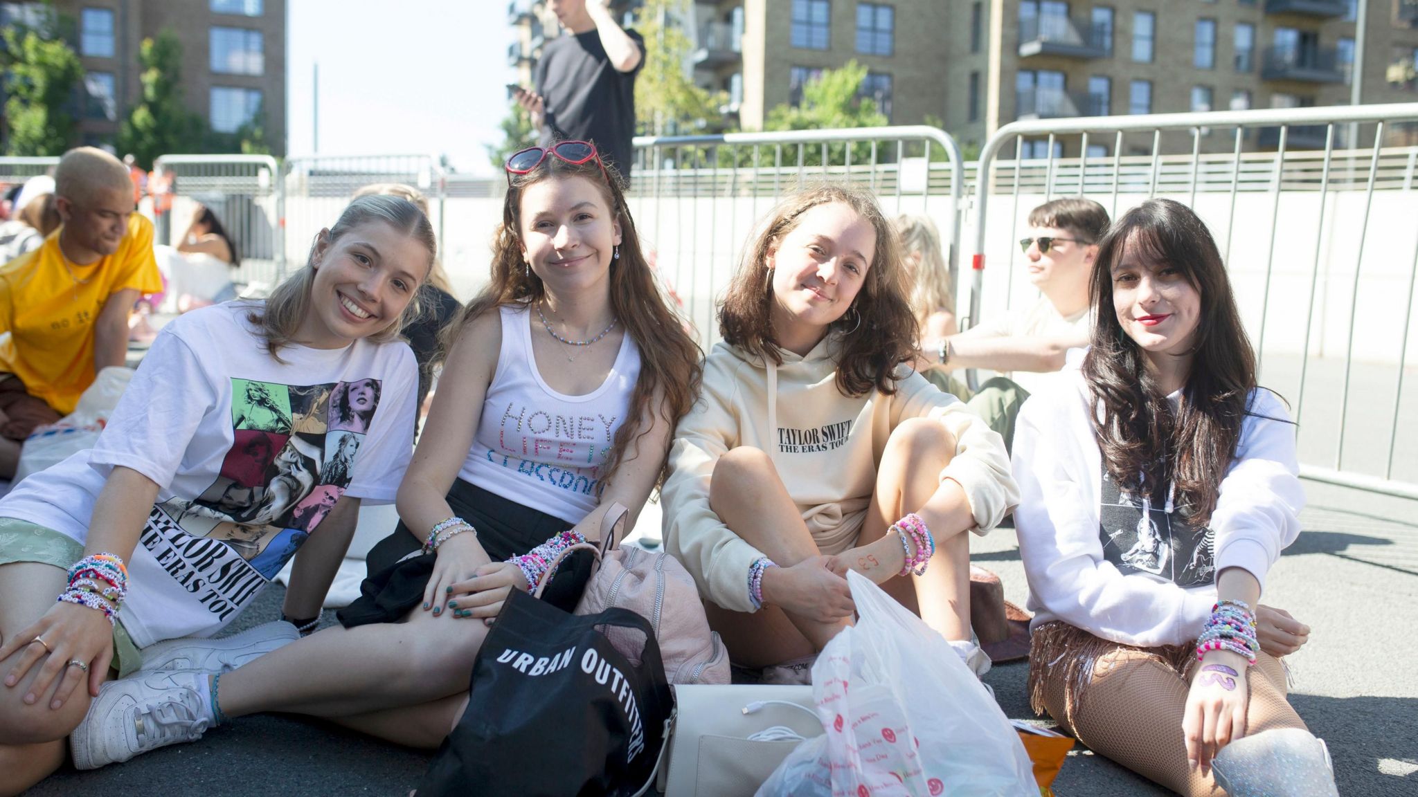 Taylor Swift fans Izzie, 18, Sophia, 19, Taylor, 19, and Mary, 27, pose for a photo as they wait to enter Wembley Stadium in London,