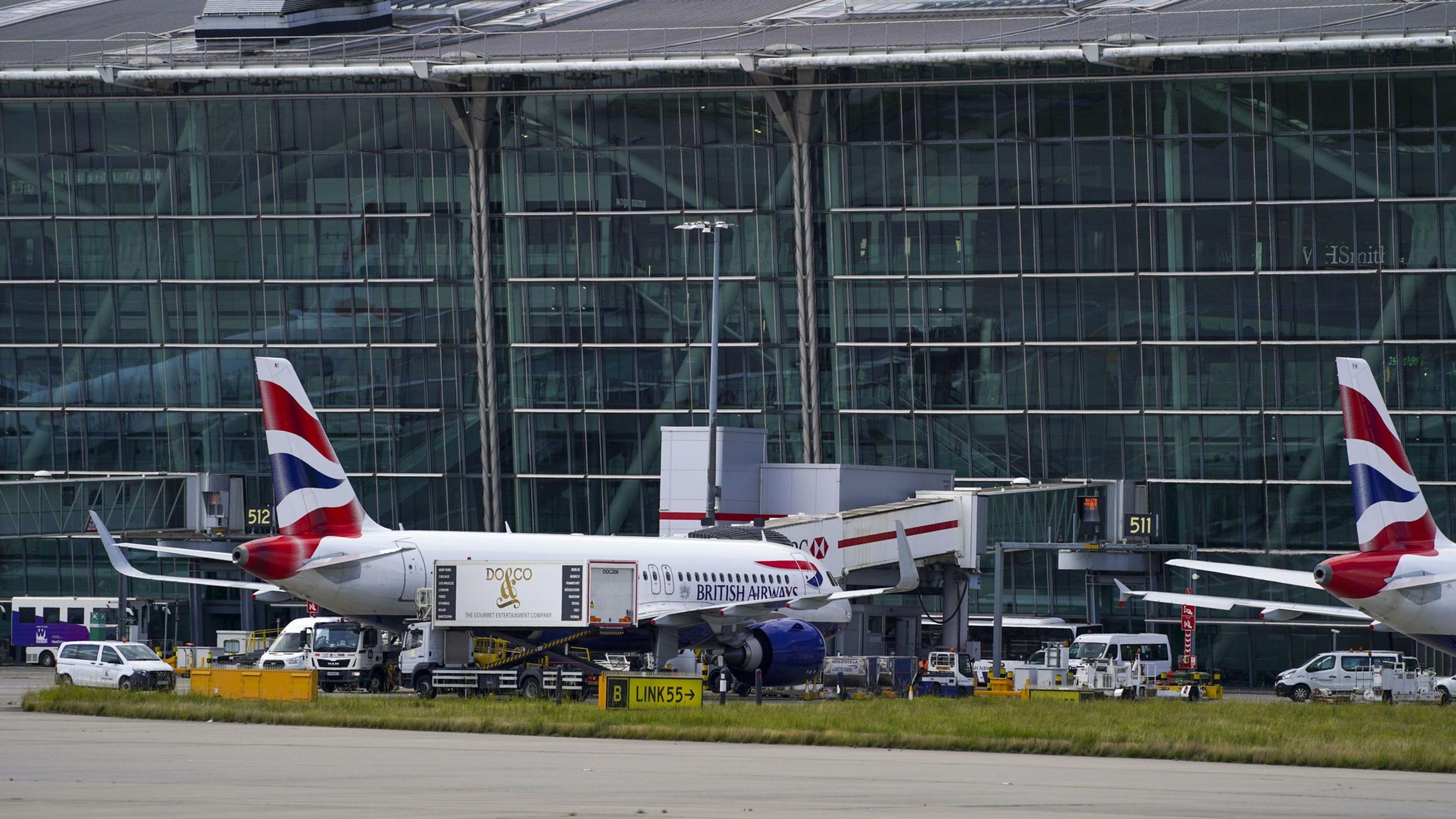 Heathrow Airport Terminal 5 showing a British Airways plane parked outside the terminal building
