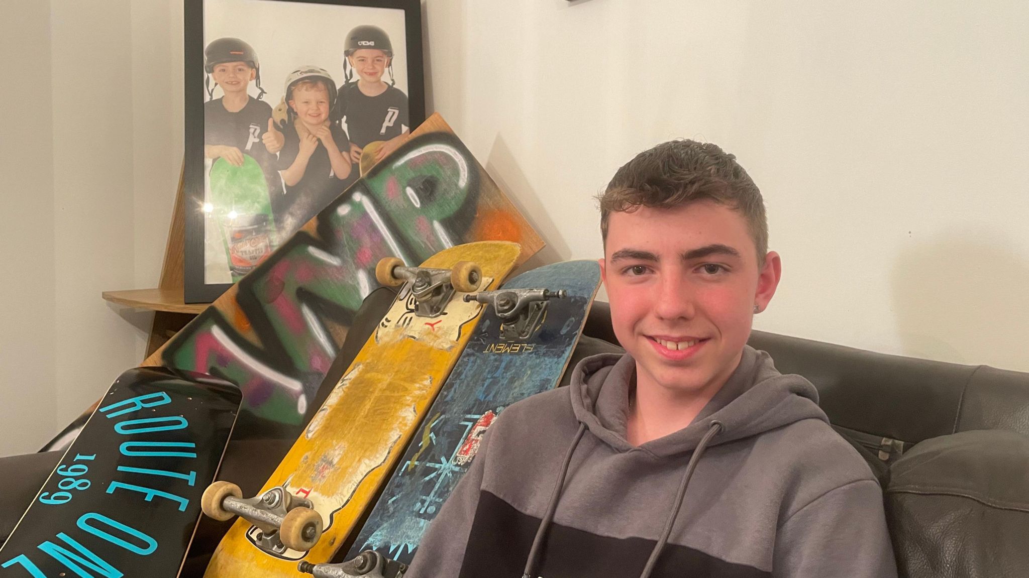 Osian George with some skateboards