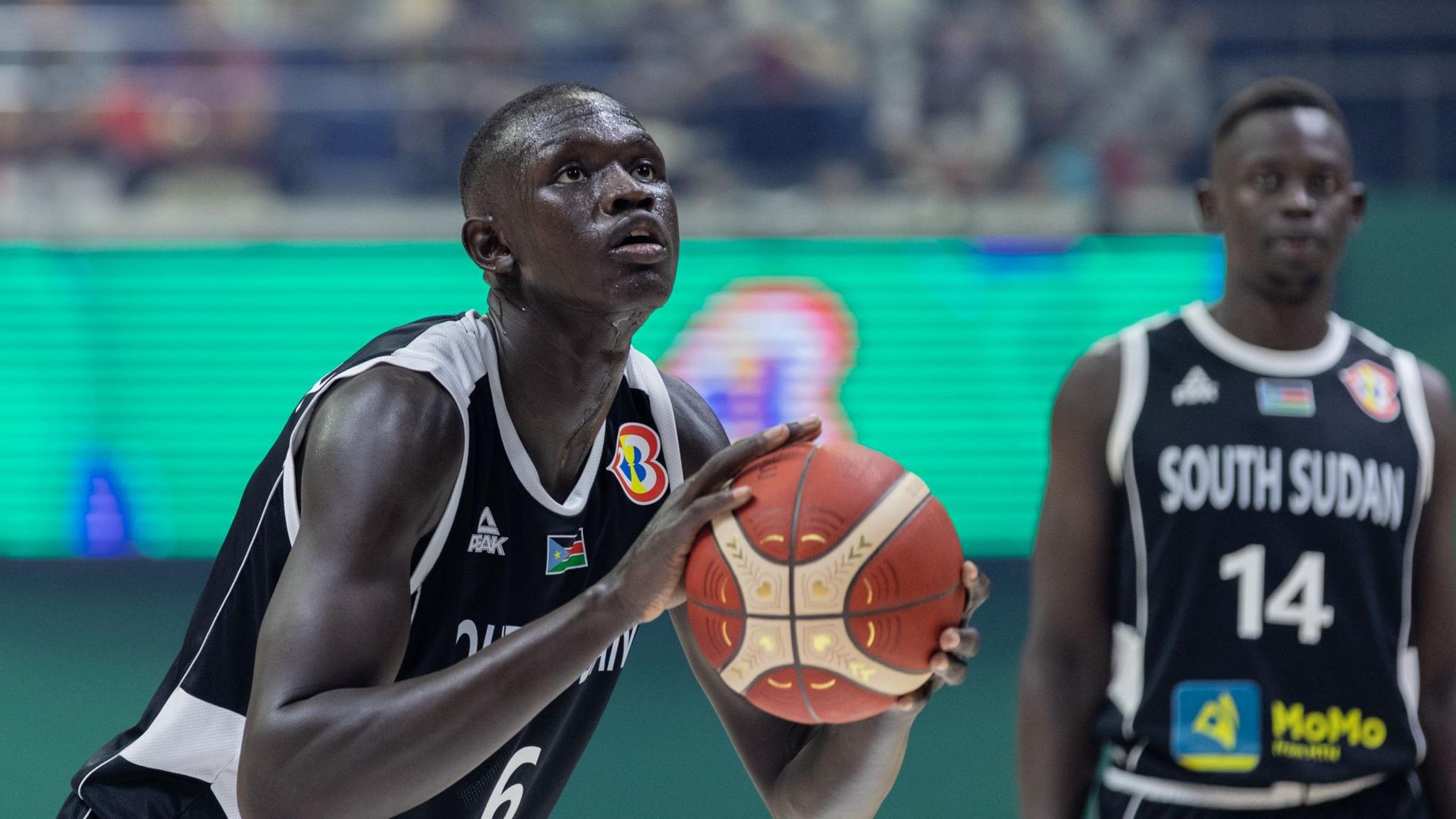 Khaman Maluach prepares to shoot during a match for South Sudan at the 2023 Fiba World Cup