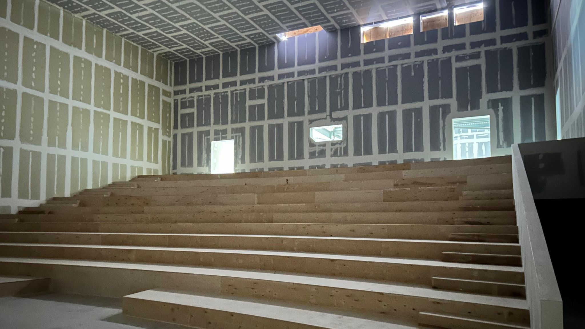 Cinema construction site with wooden seating frames 