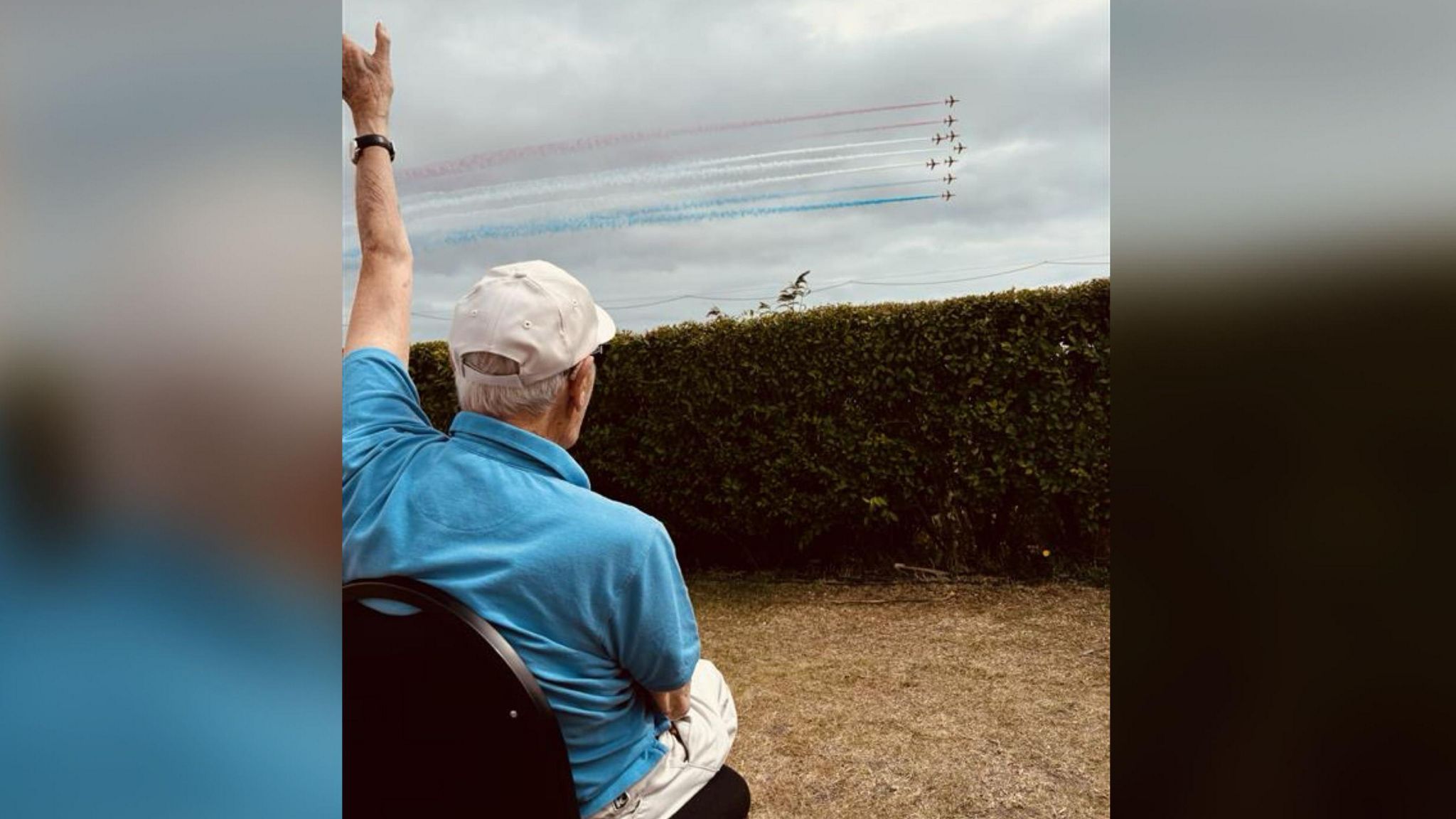 Jack Hemmings waving at planes flying by