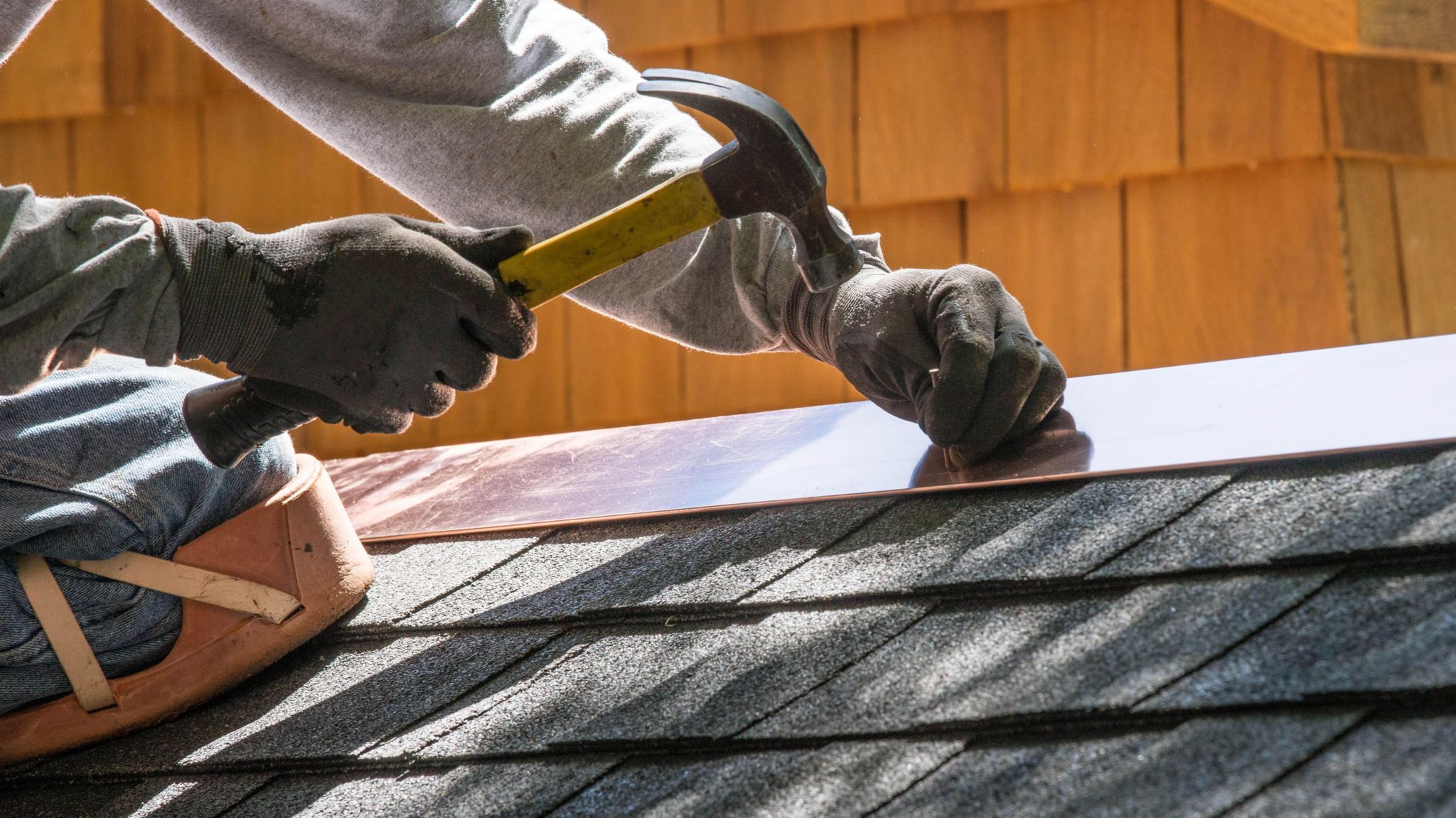 A man fixing a roof