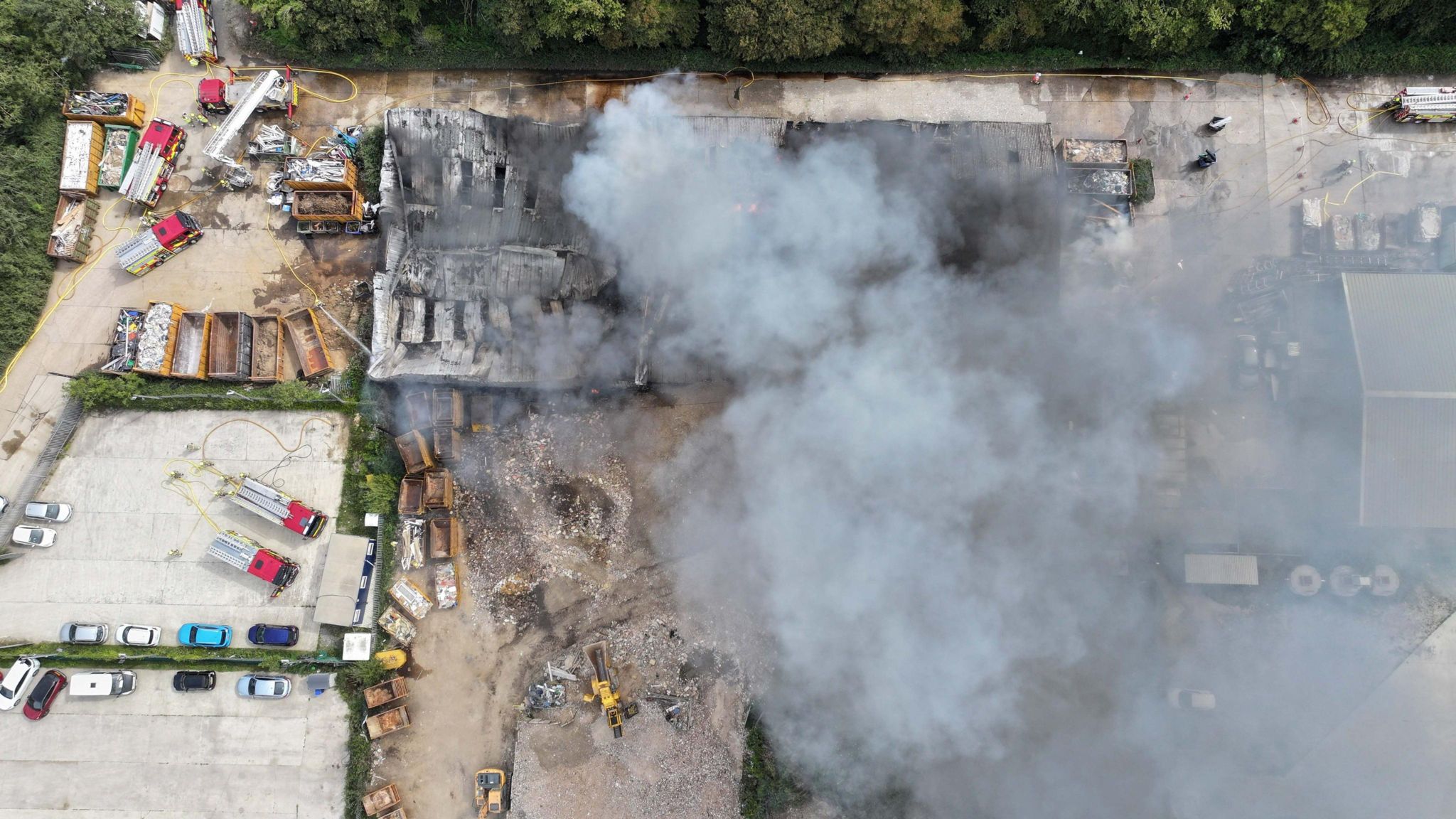 An aerial shot shows smoke rising from the scene of the fire at a waste services site in Climping