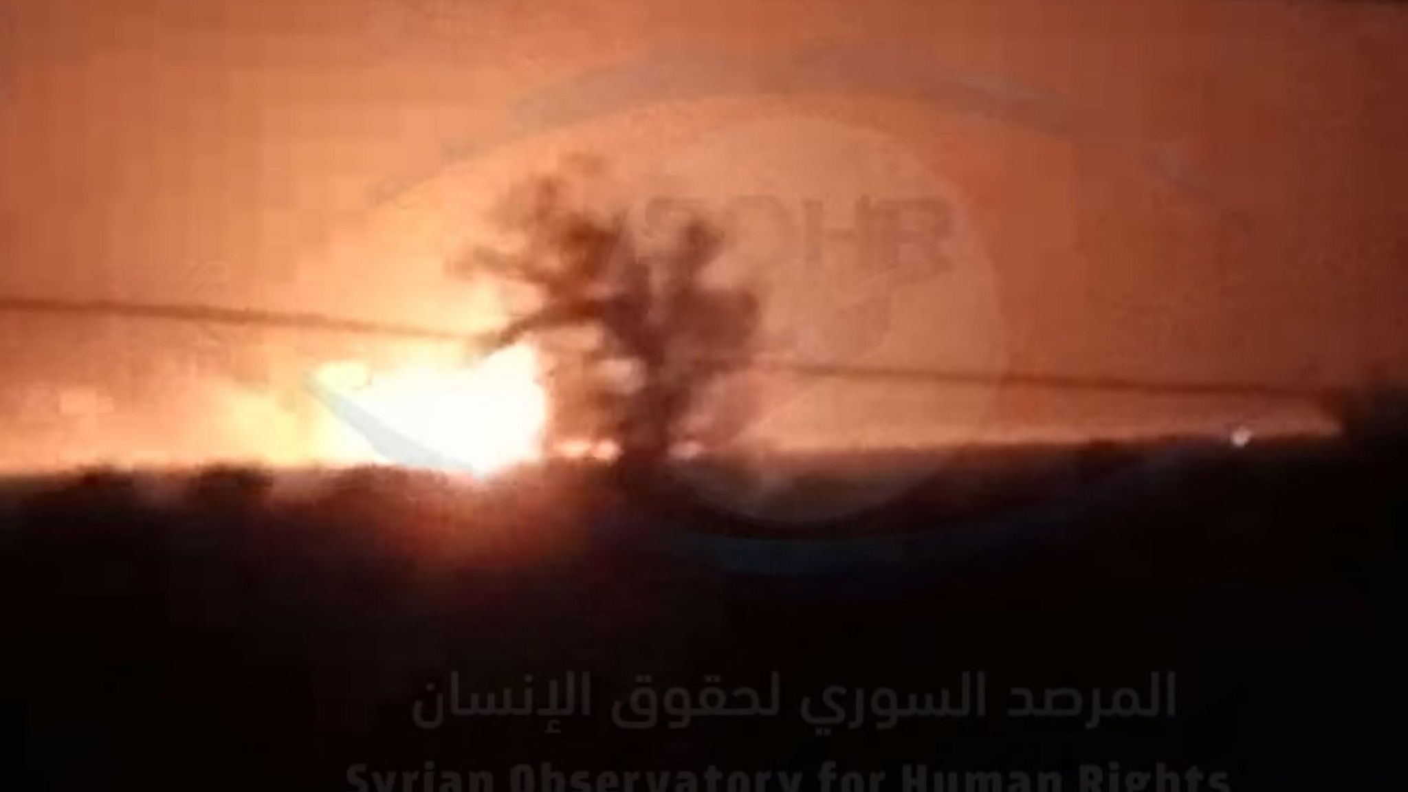 Screengrab of video from the Syrian Observatory for Human Rights purportedly showing an explosion caused by a US military air strike on warehouses in Ayyash, Syria (24 August 2022)