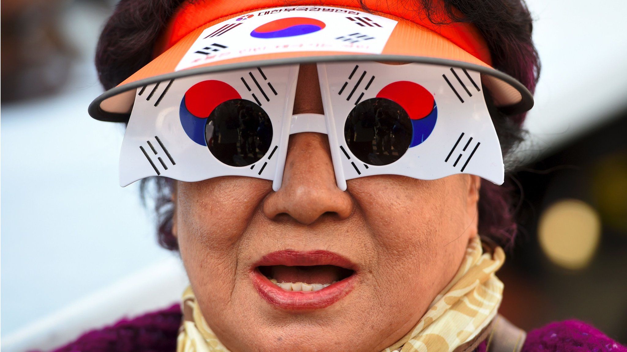 A supporter of South Korea's impeached-President Park Geun-hye wears glasses decorated as the South Korean national flag, on March 11, 2017, in Seoul, South Korea.