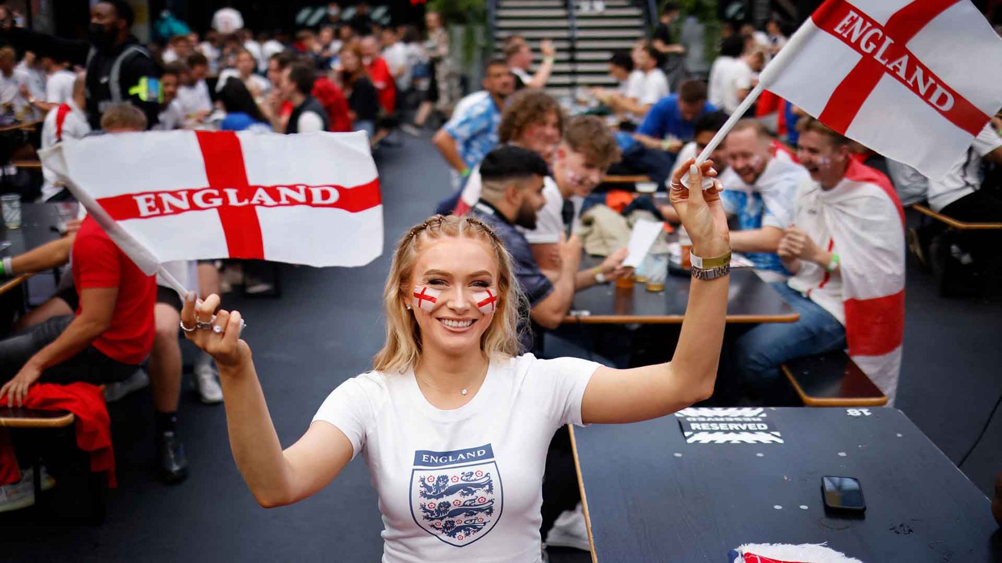 Woman watches England semi final at Croydon Box Park