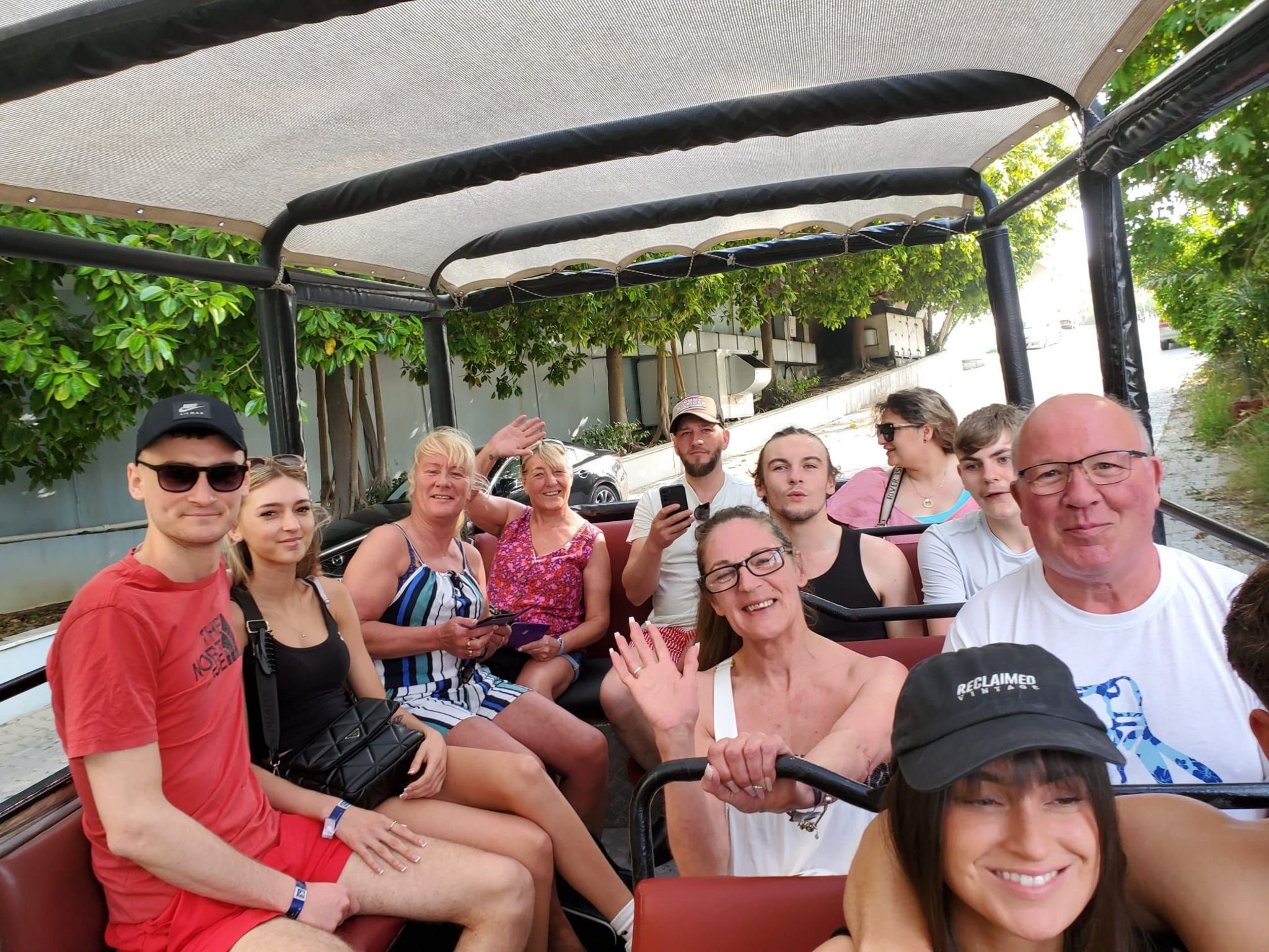 The group of family and friends travelling on the tour bus