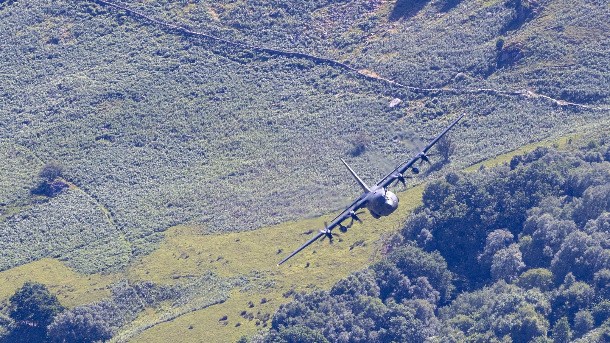 RAF Hercules flying through the mountains of north Wales