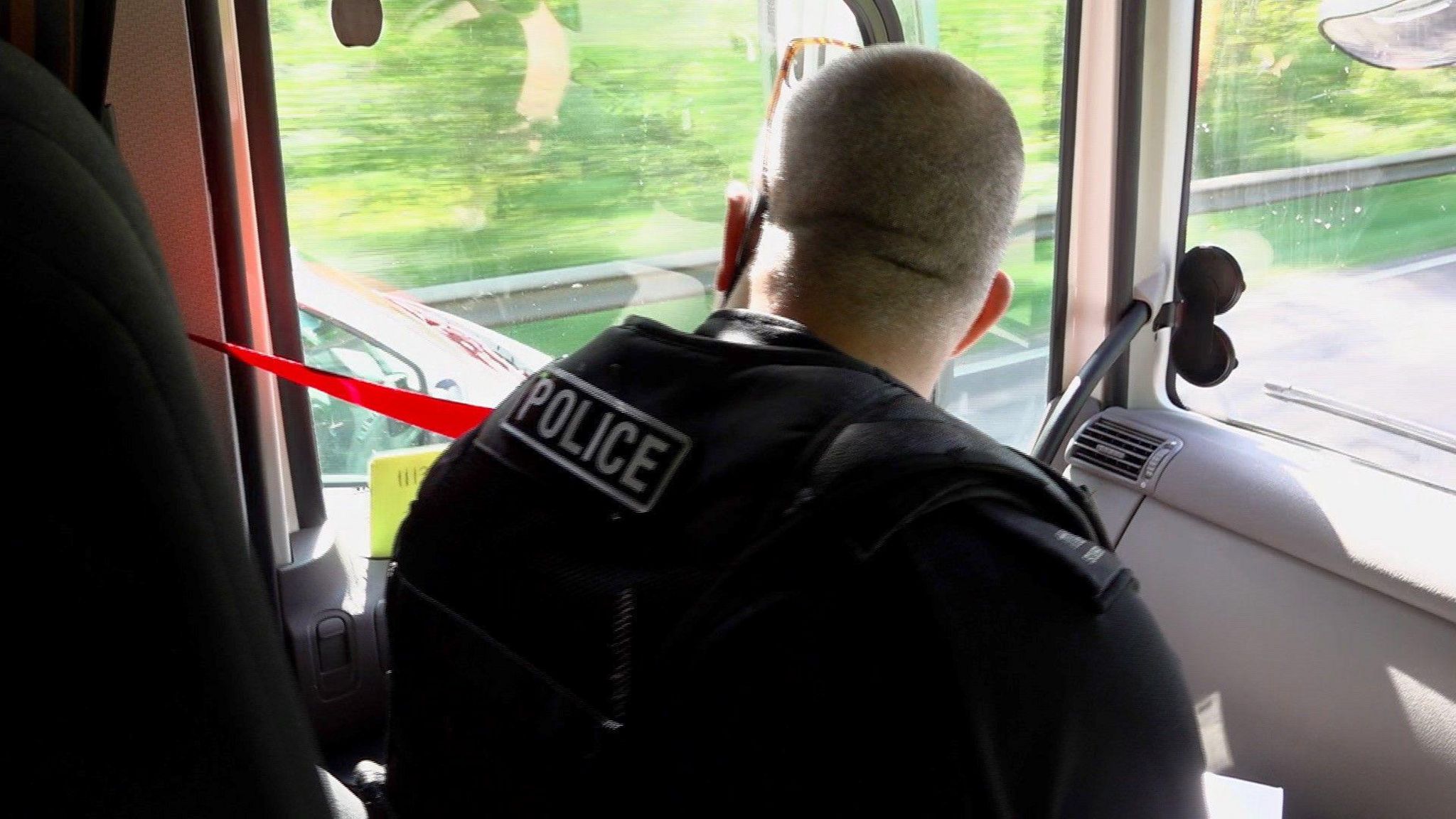 A police officer inside the lorry cab