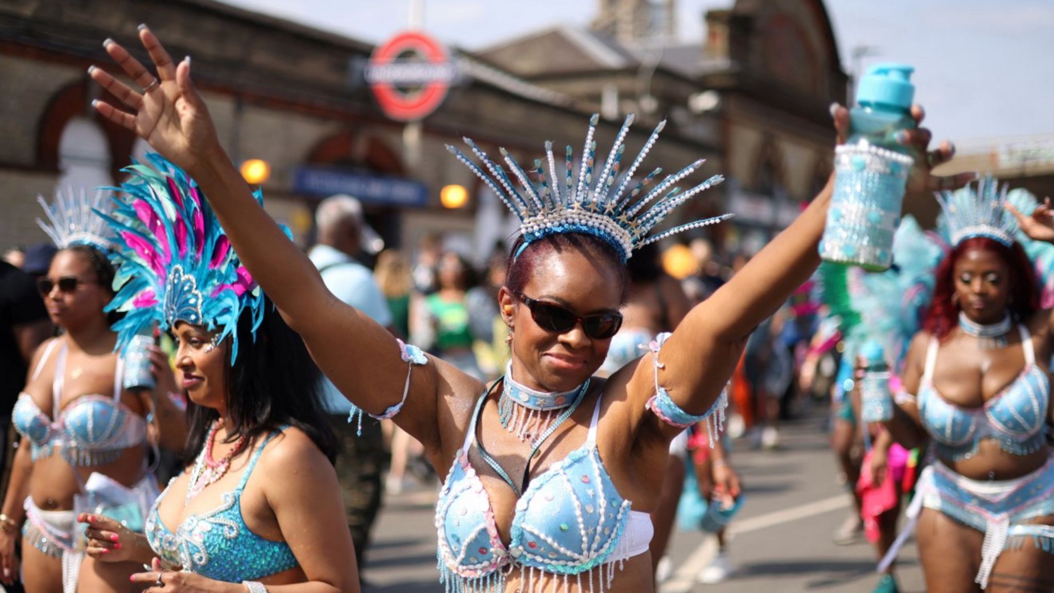 A reveller gestures during the Notting Hill Carnival parade in west London