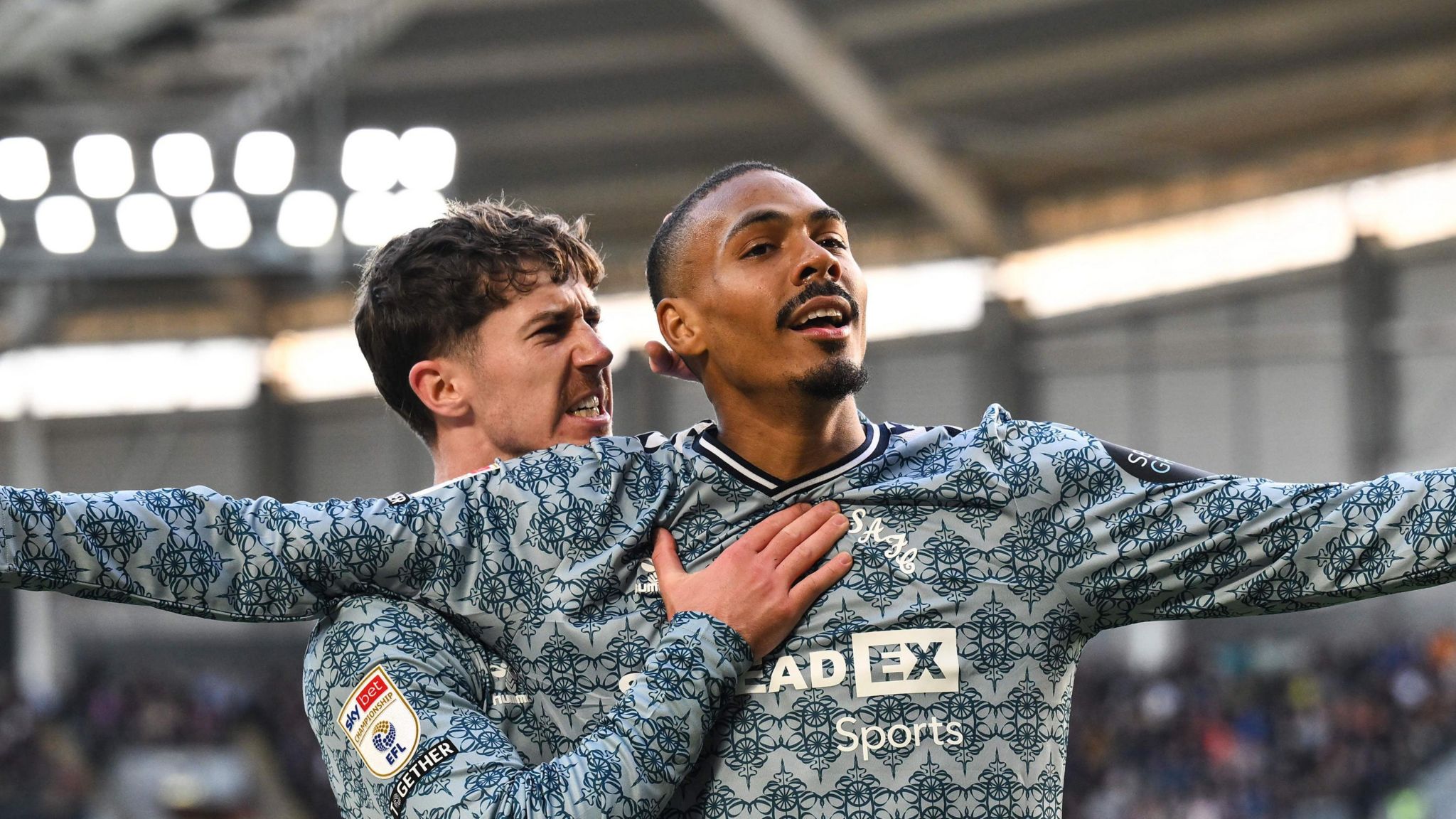 Wilson Isidor celebrating his goal with team-mate Trai Hume