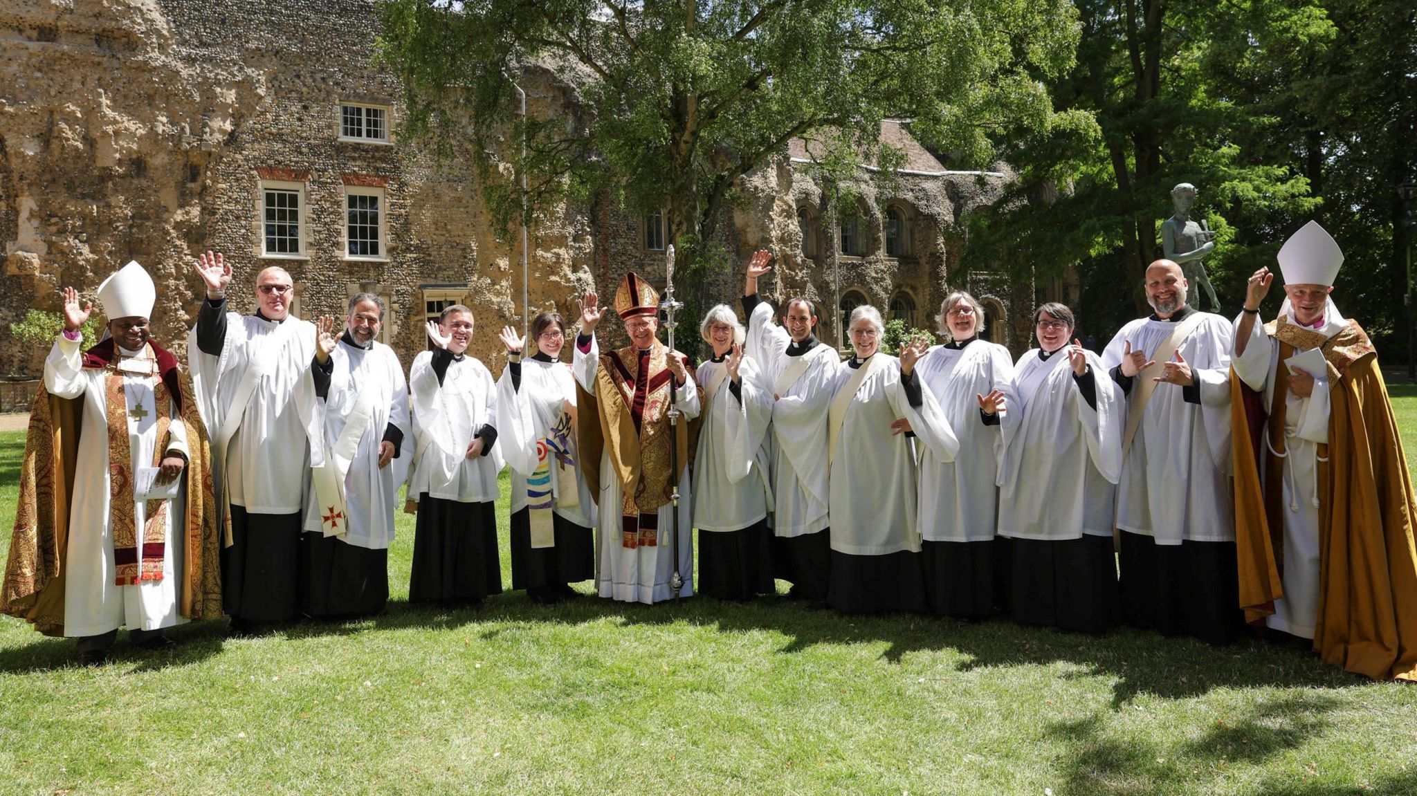 Priests and deacons outside St Edmundsbury Cathedral, in Bury St Edmunds