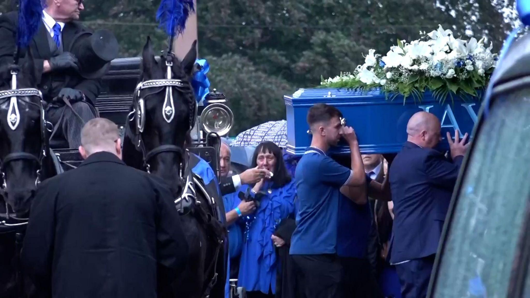 The coffin of Jay Slater being carried into Accrington Cemetery Chape